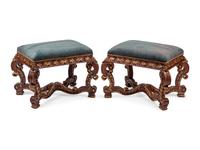 A Pair of Italian Baroque Style Carved and Parcel Gilt Benches