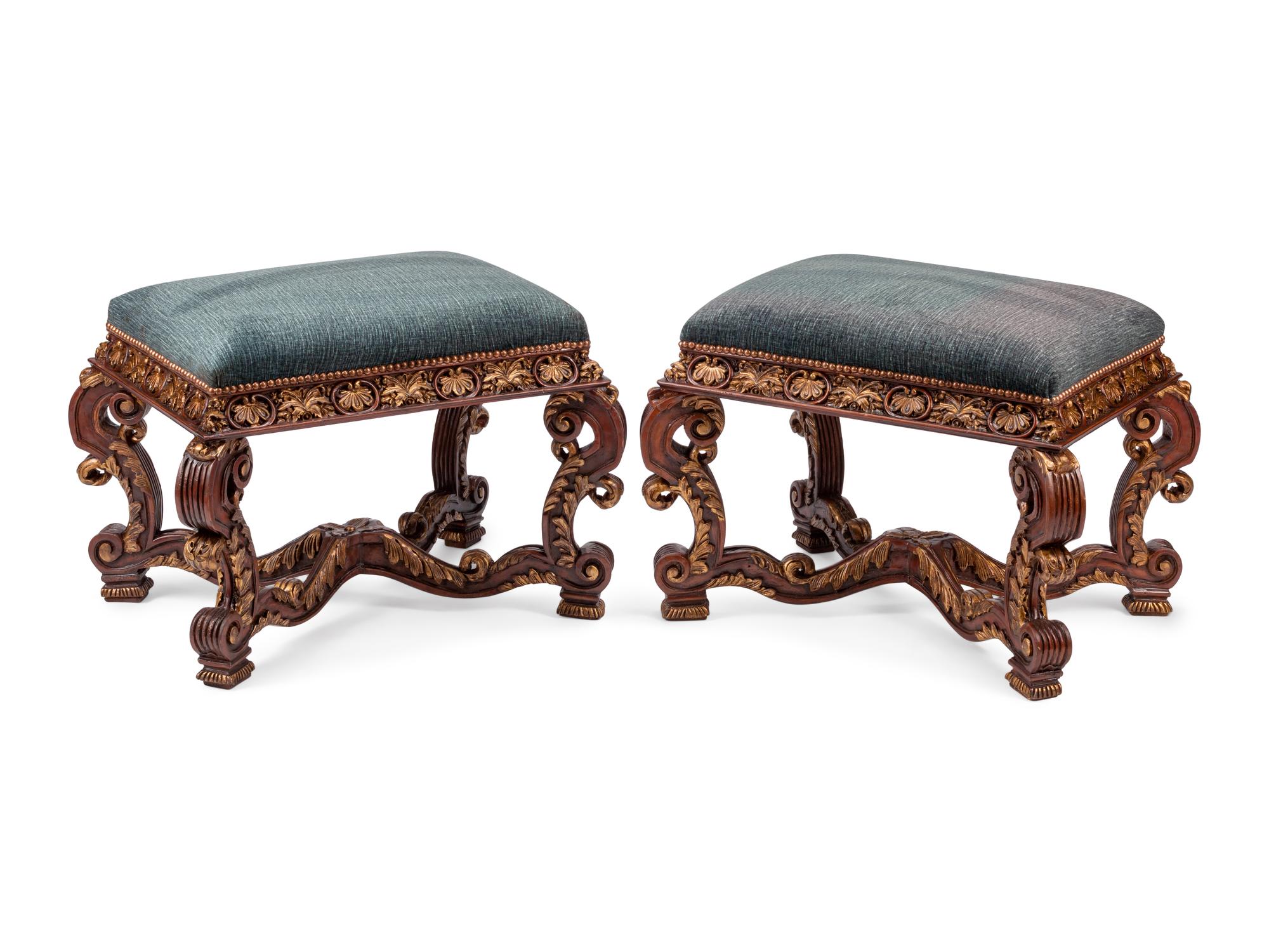 A Pair of Italian Baroque Style Carved and Parcel Gilt Benches