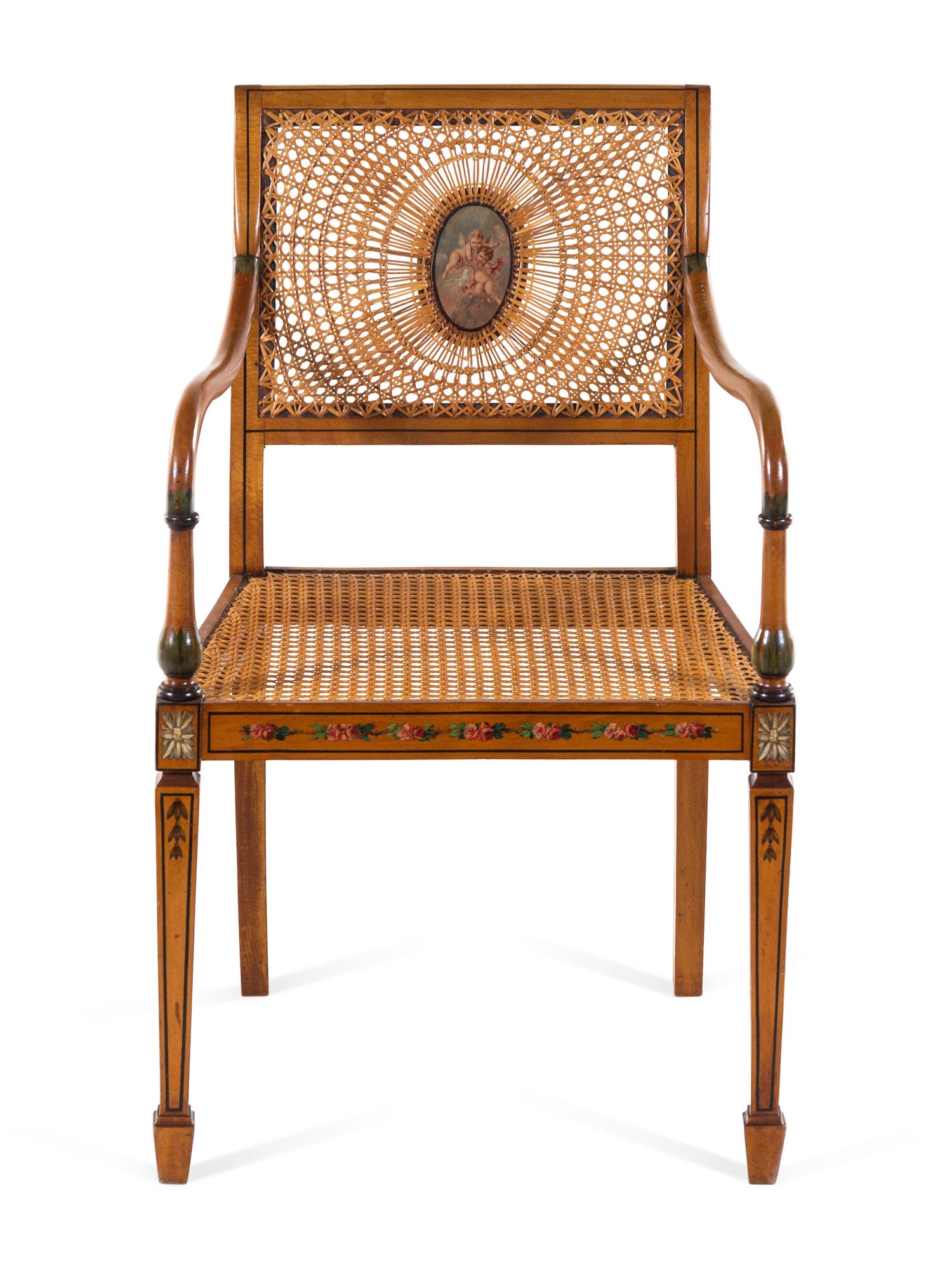 An Edwardian Painted Beechwood Cane Upholstered Armchair