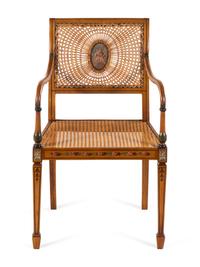 An Edwardian Painted Beechwood Cane Upholstered Armchair