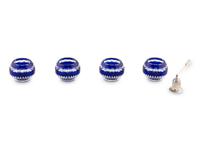 A Set of Four Modern Fabergé Blue Cut-to-Clear Glass Votive Holders and a John Hardy Silver Snuffer
