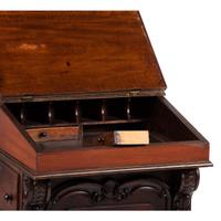 A Victorian Carved Mahogany Davenport Desk