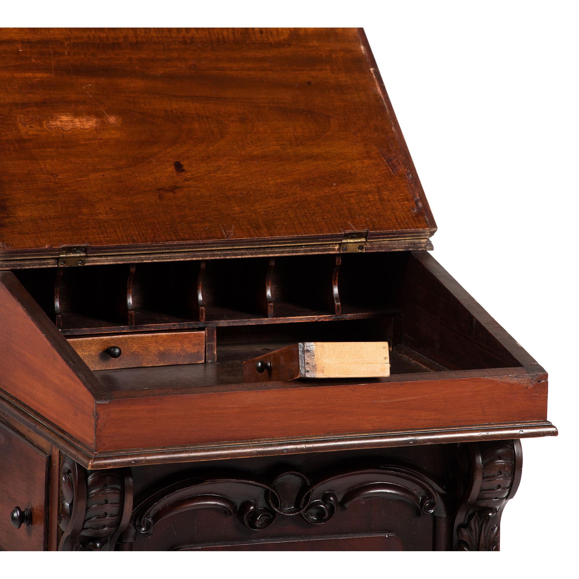 A Victorian Carved Mahogany Davenport Desk