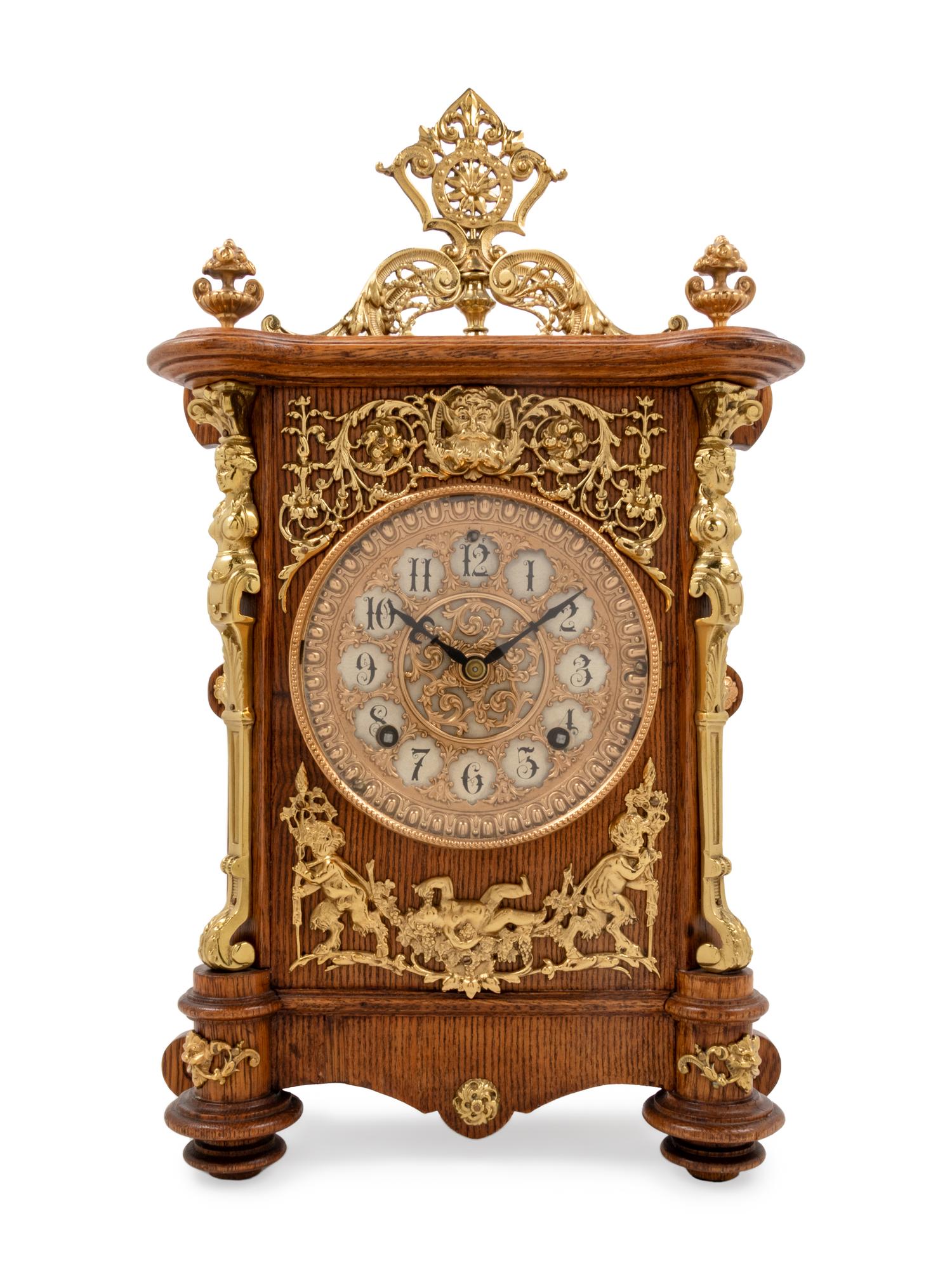 An Ansonia Cabinet B Gilt Metal Mounted Oak Shelf Clock