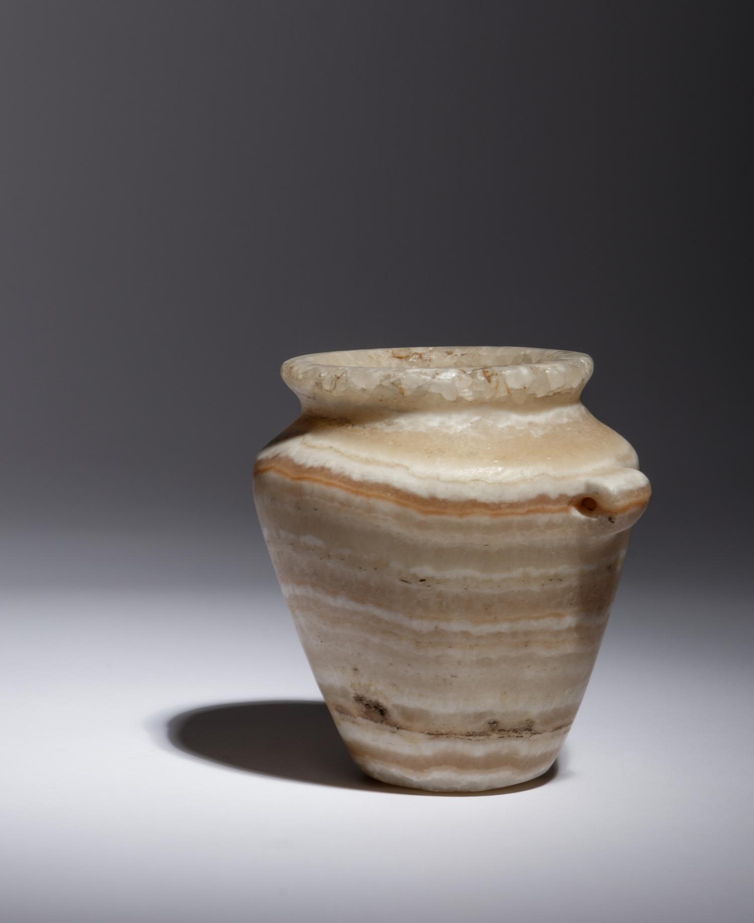 An Egyptian Alabaster Lug Handled Jar