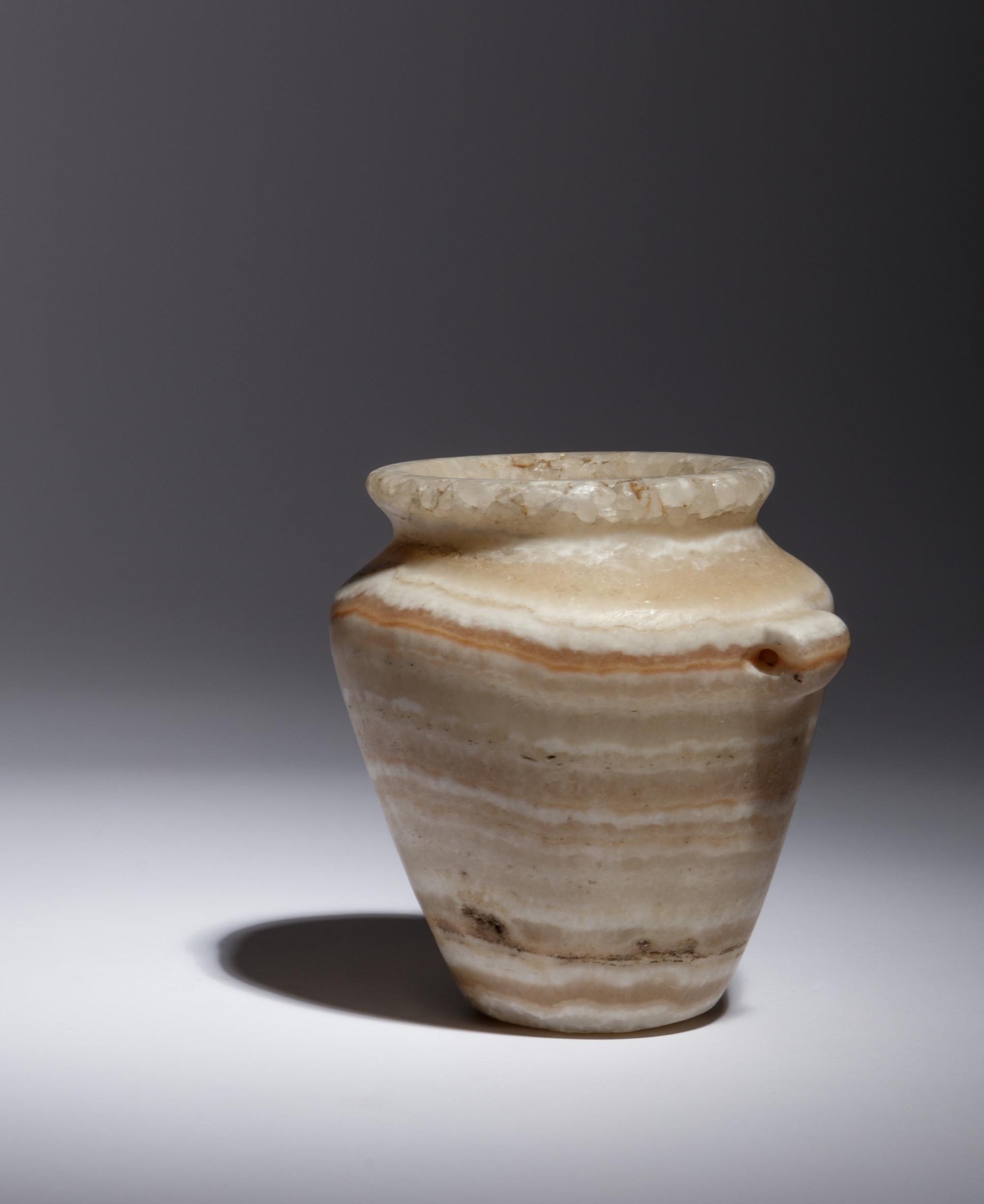 An Egyptian Alabaster Lug Handled Jar