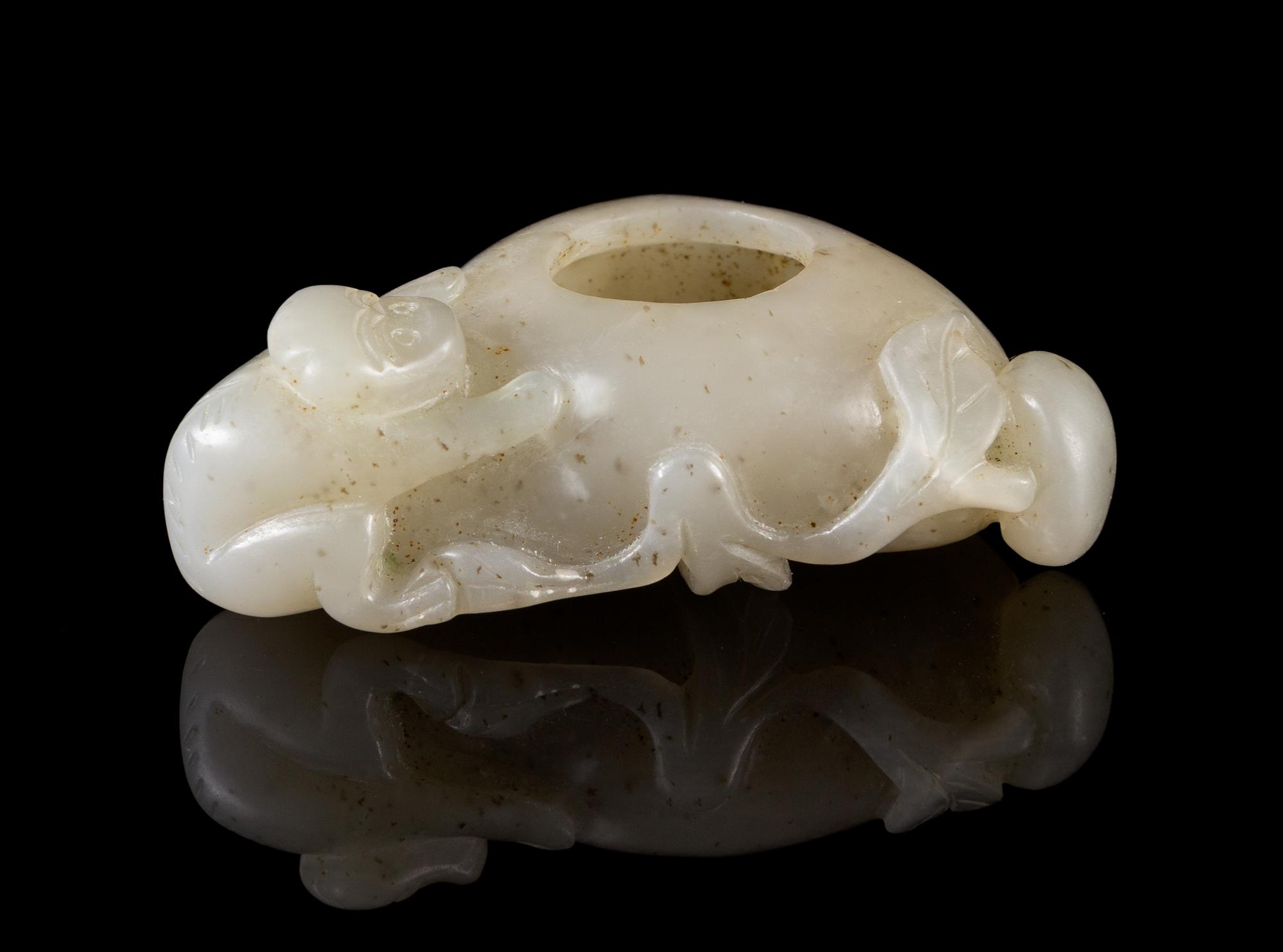 A Carved Celadon Jade Water Pot with Monkeys Length 2 1/2 inches.