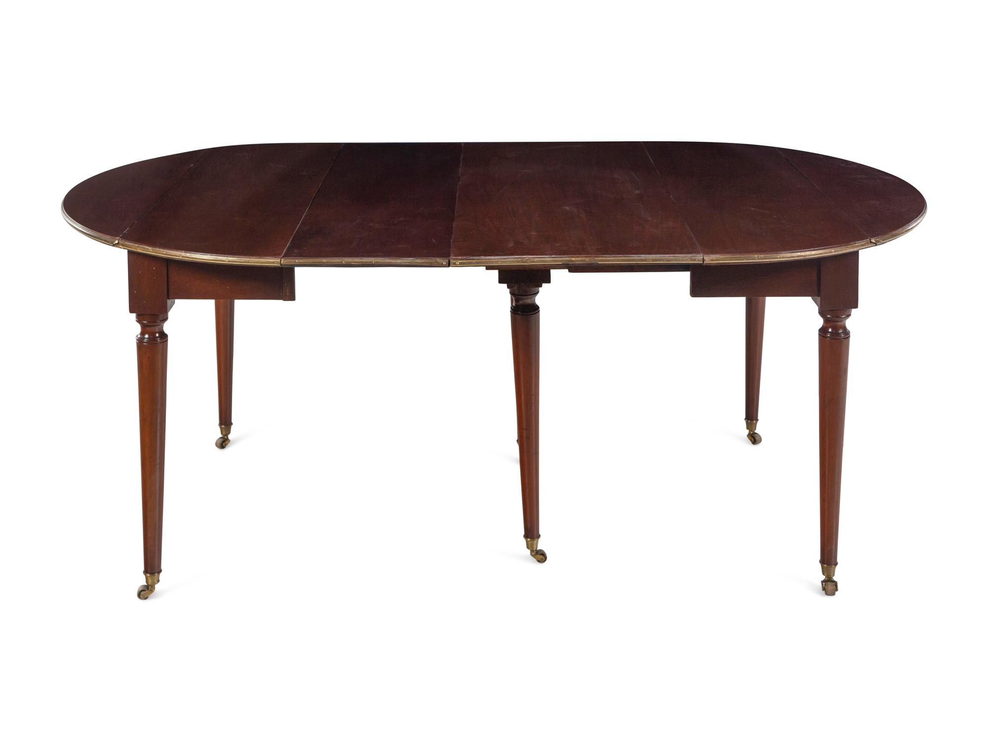 A French Brass Mounted Mahogany Drop-Leaf Dining Table