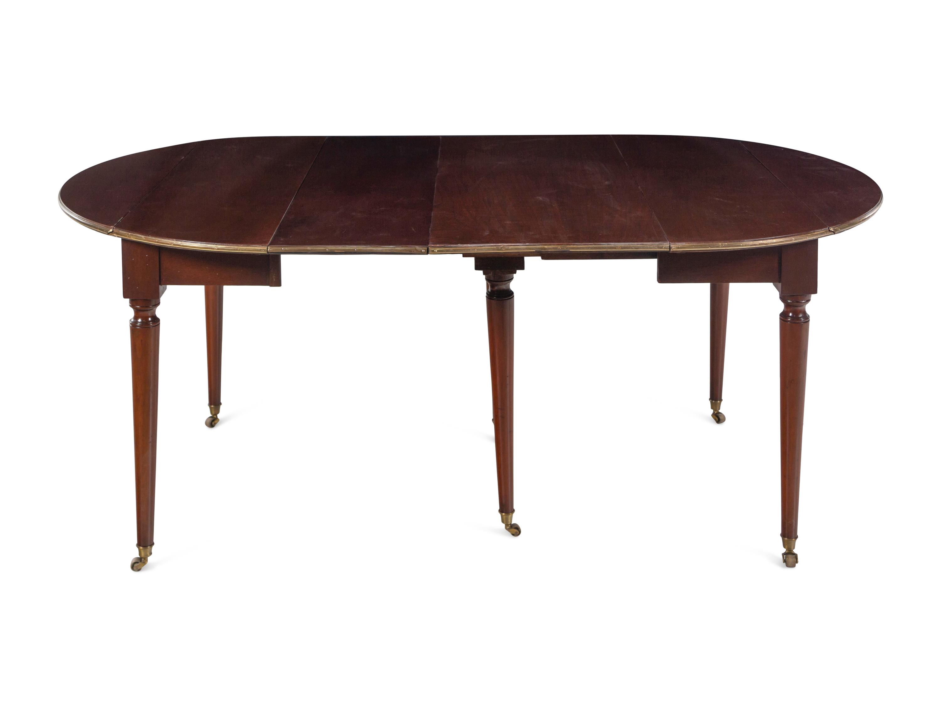 A French Brass Mounted Mahogany Drop-Leaf Dining Table