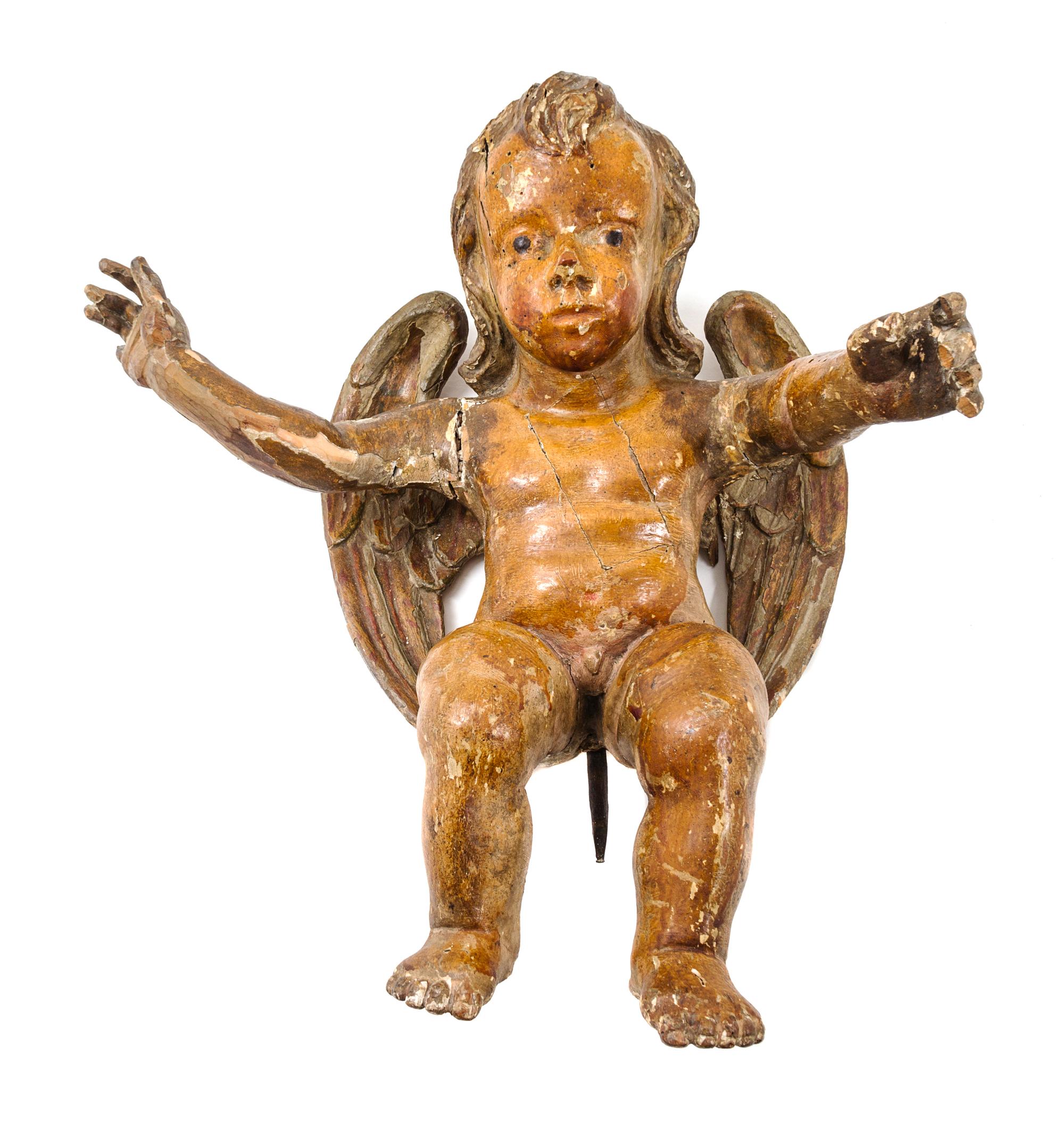 A Carved and Painted Wood Figure of a Cherub Height 18 inches. — 18TH/19TH CENTURY