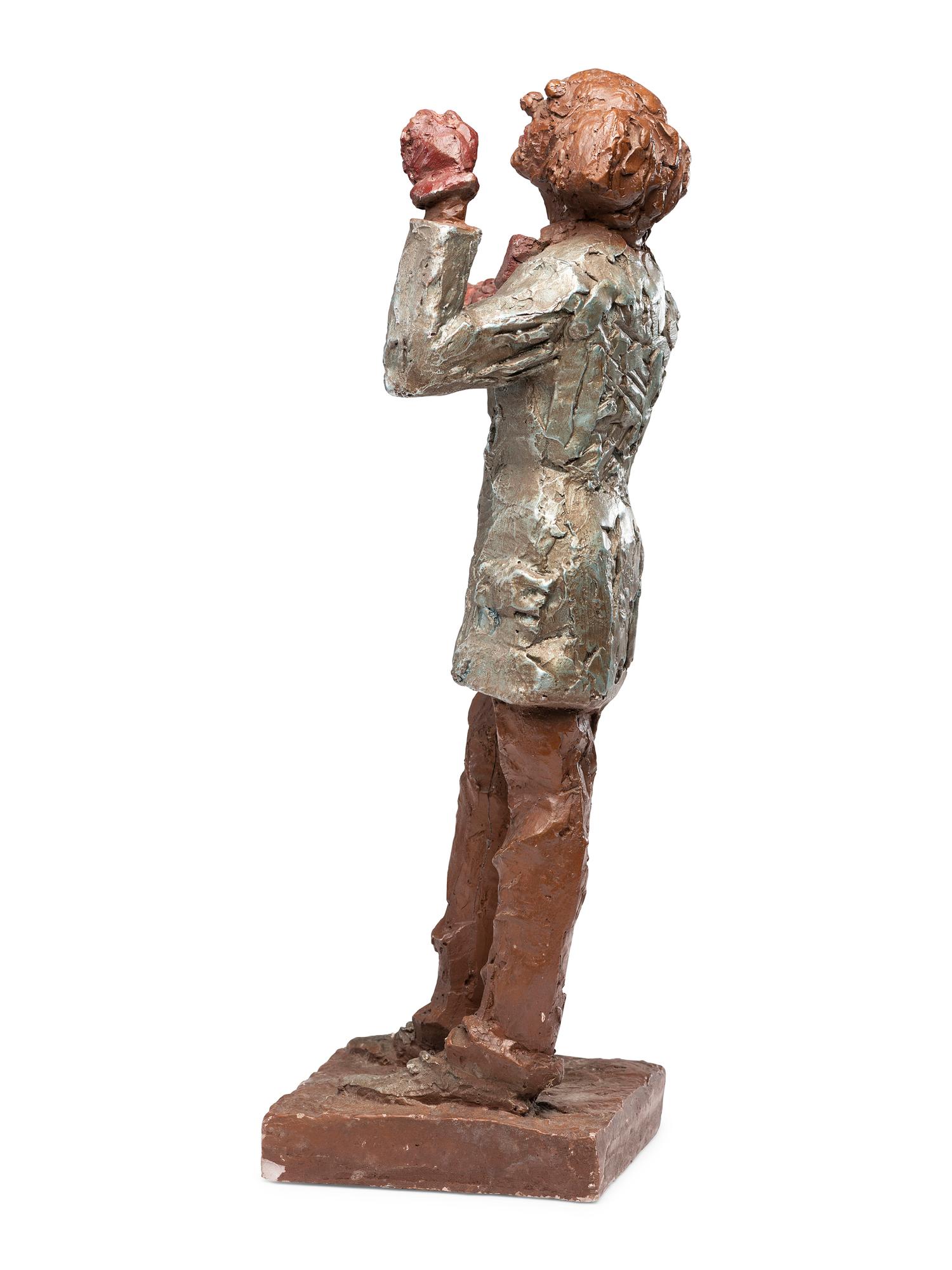 A Carved and Painted Plaster Folk Art Sculpture of a Standing Man