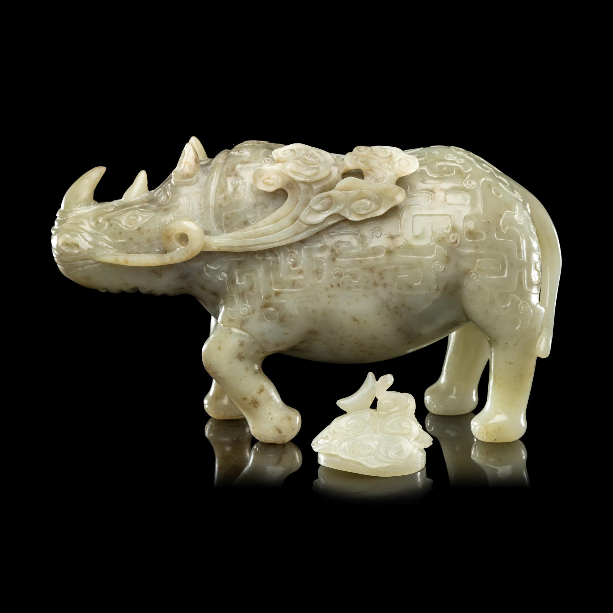 A Chinese Carved Celadon Jade Archaistic Rhinoceros-Form Covered Vessel, 20th Century 近代 青玉仿古犀尊