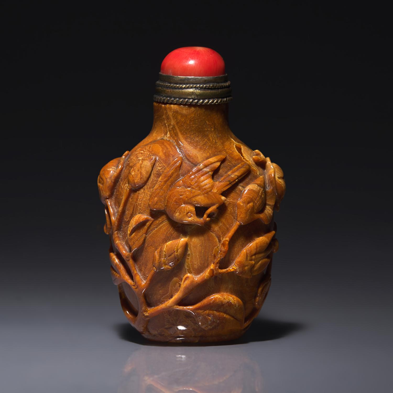 A Chinese Bird and Flower-Carved Root Amber Snuff Bottle 琥珀雕花鳥鼻烟壺