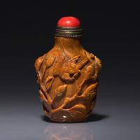 A Chinese Bird and Flower-Carved Root Amber Snuff Bottle 琥珀雕花鳥鼻烟壺