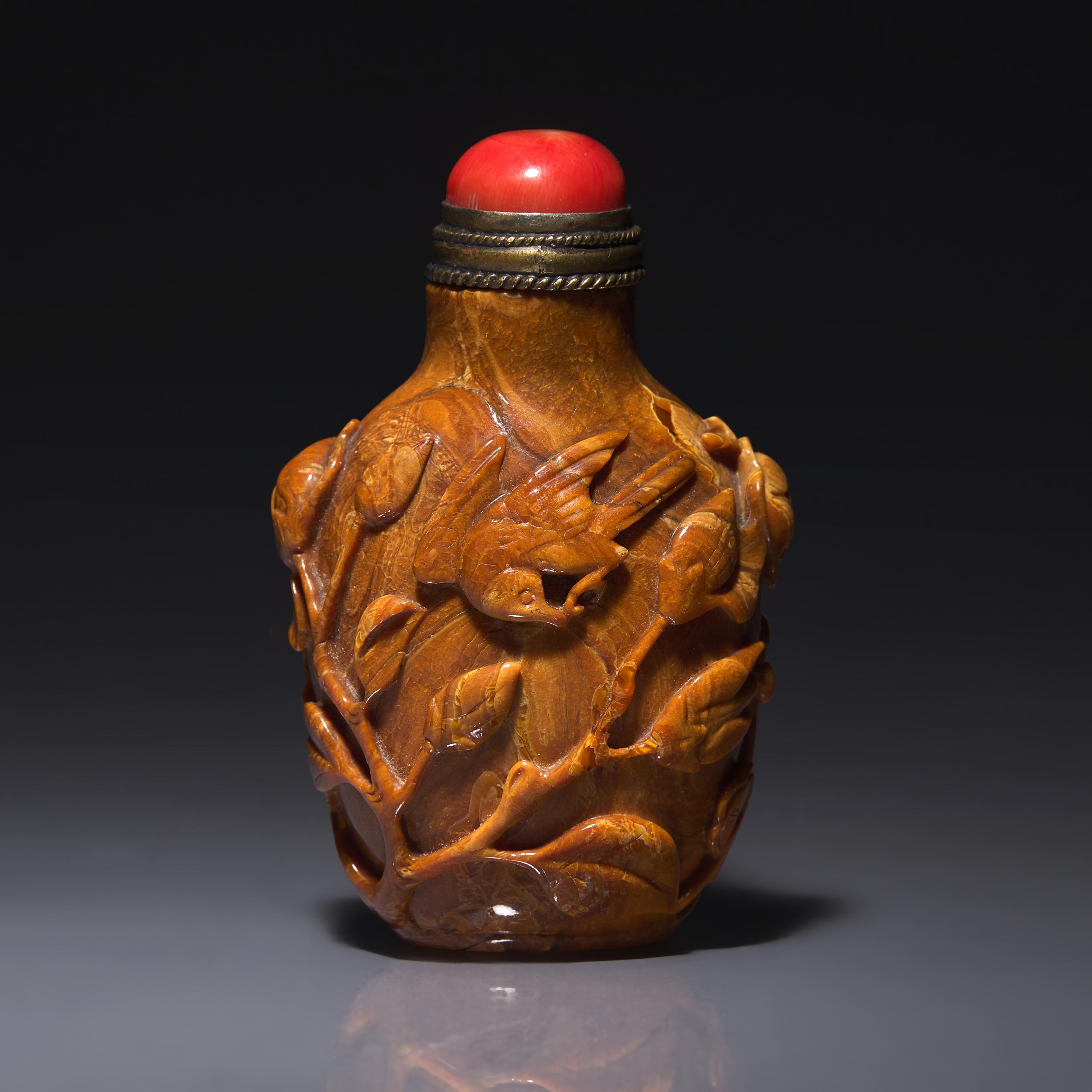 A Chinese Bird and Flower-Carved Root Amber Snuff Bottle 琥珀雕花鳥鼻烟壺