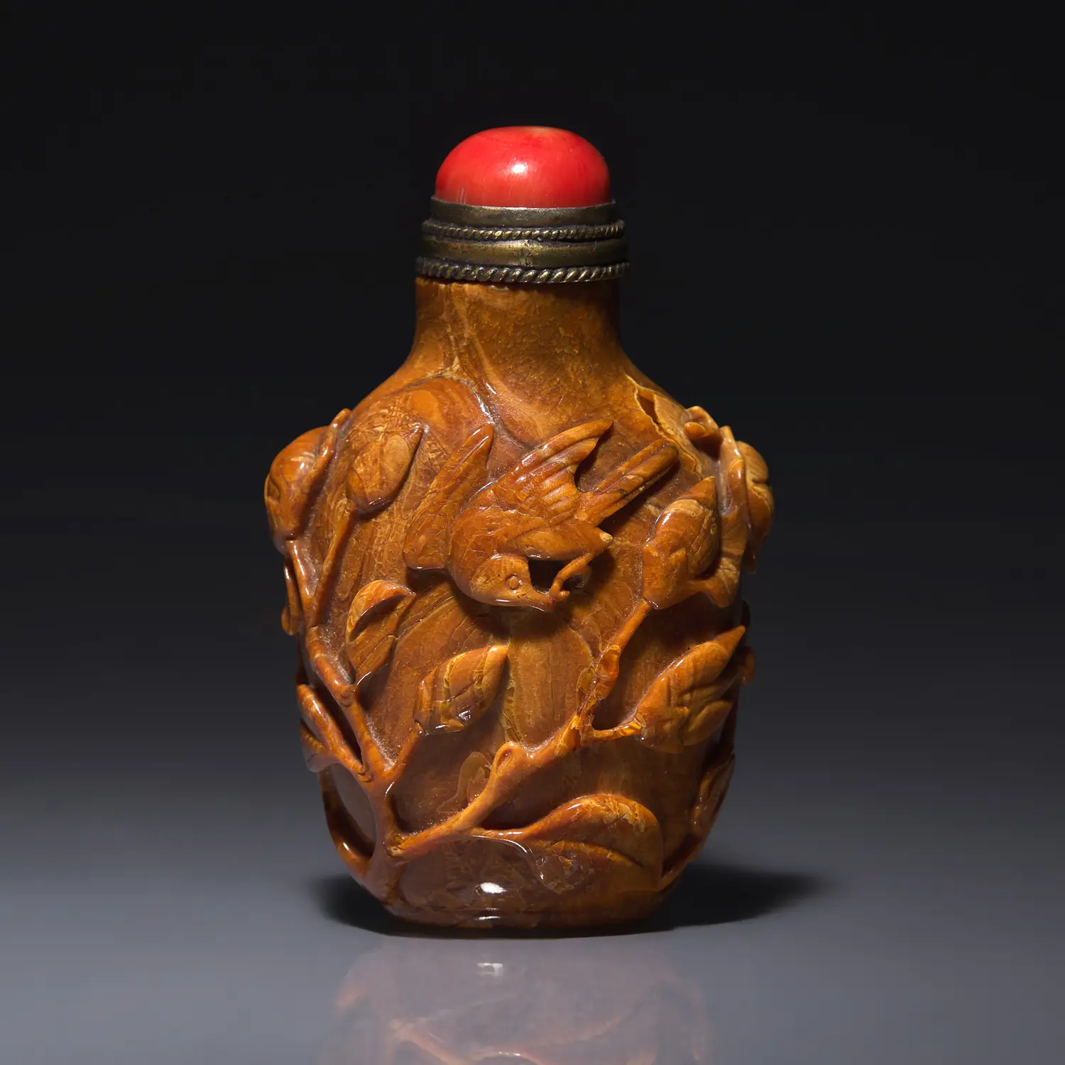 A Chinese Bird and Flower-Carved Root Amber Snuff Bottle