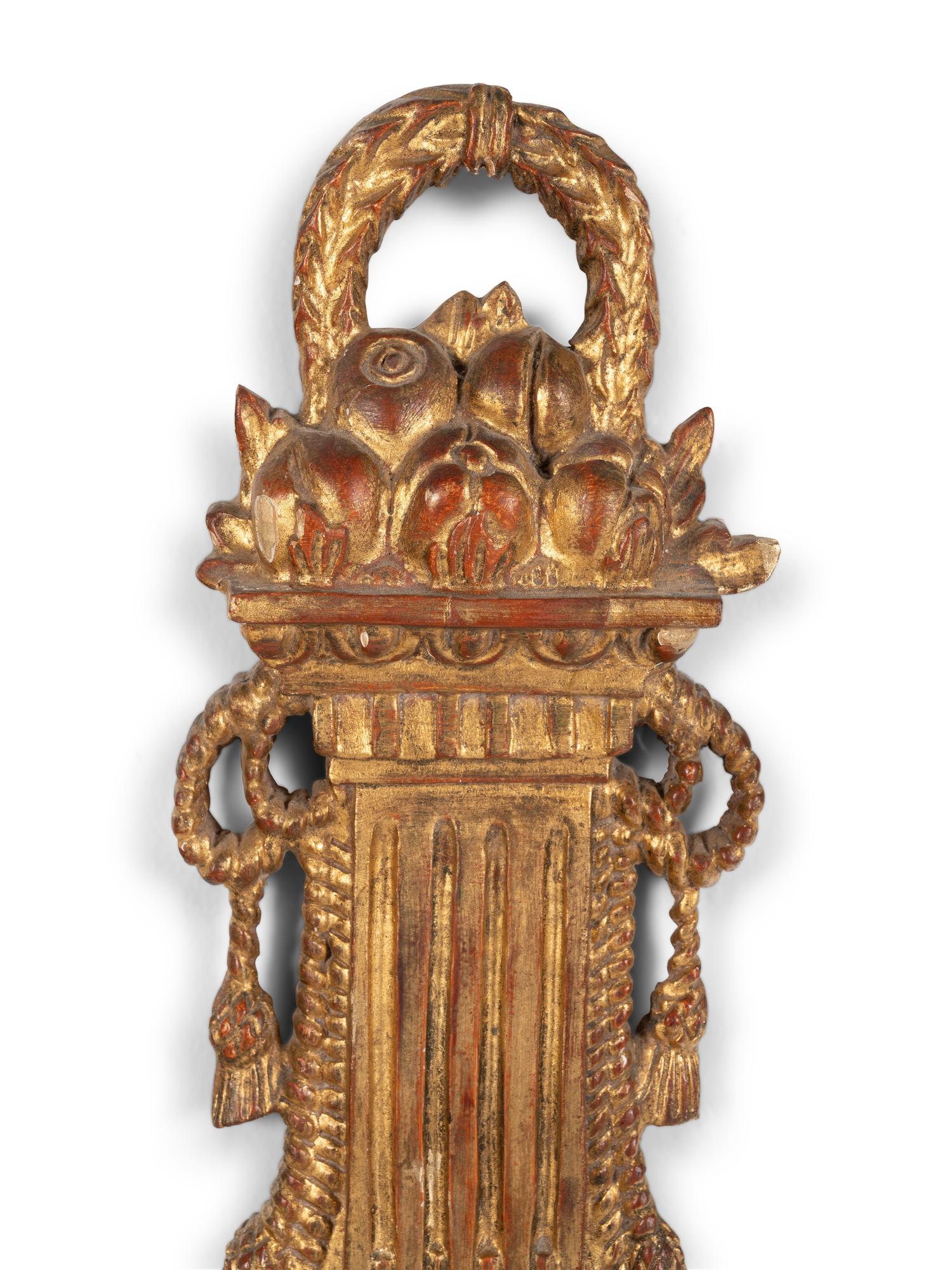 A Louis XVI Style Giltwood Cartel Clock