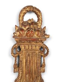 A Louis XVI Style Giltwood Cartel Clock