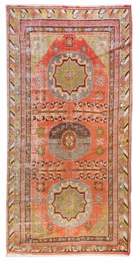 A Khotan Wool Rug 10 feet x 5 feet 2 inches. — EAST TURKESTAN, LATE 19TH CENTURY