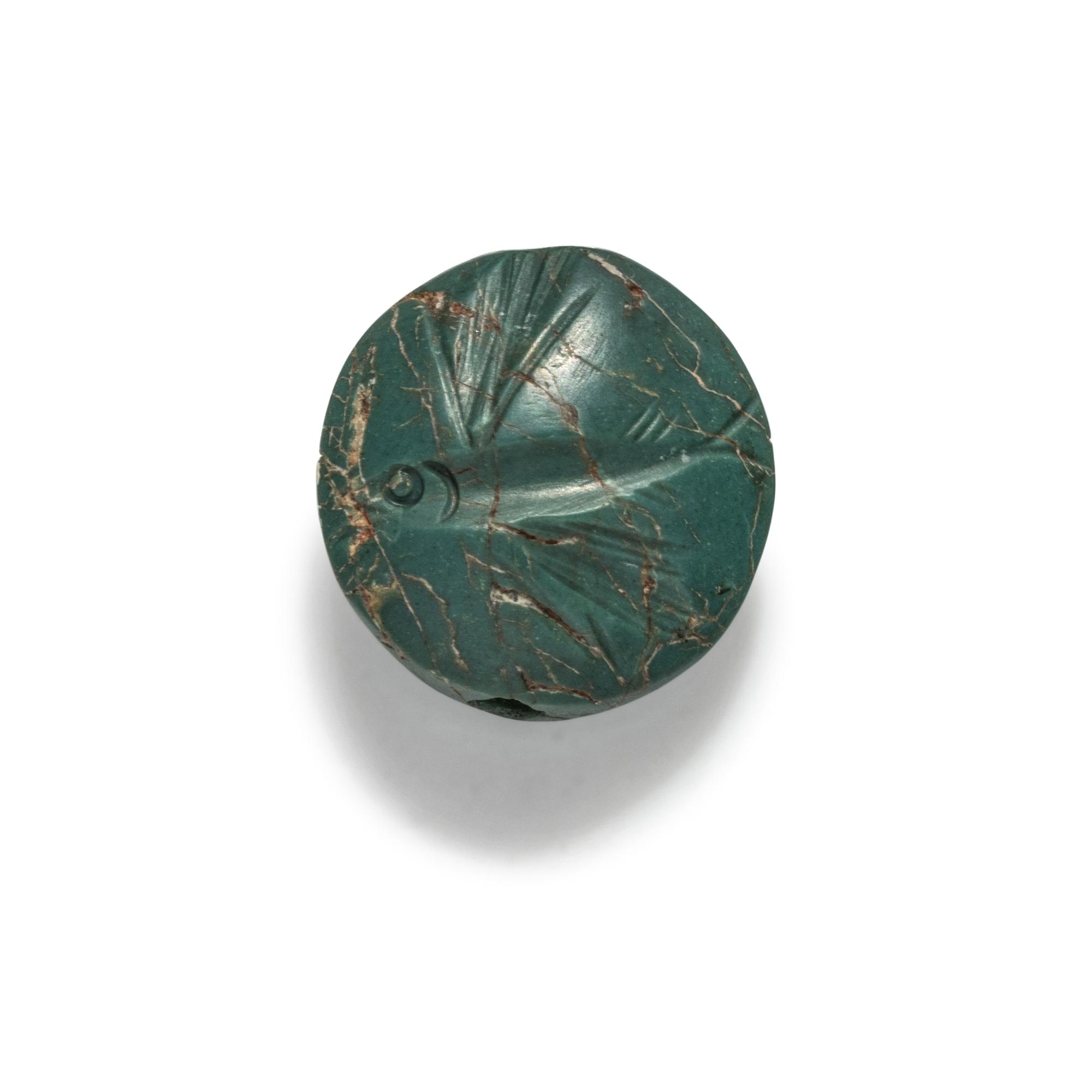 A Minoan Green Jasper Lentoid with a Flying Fish