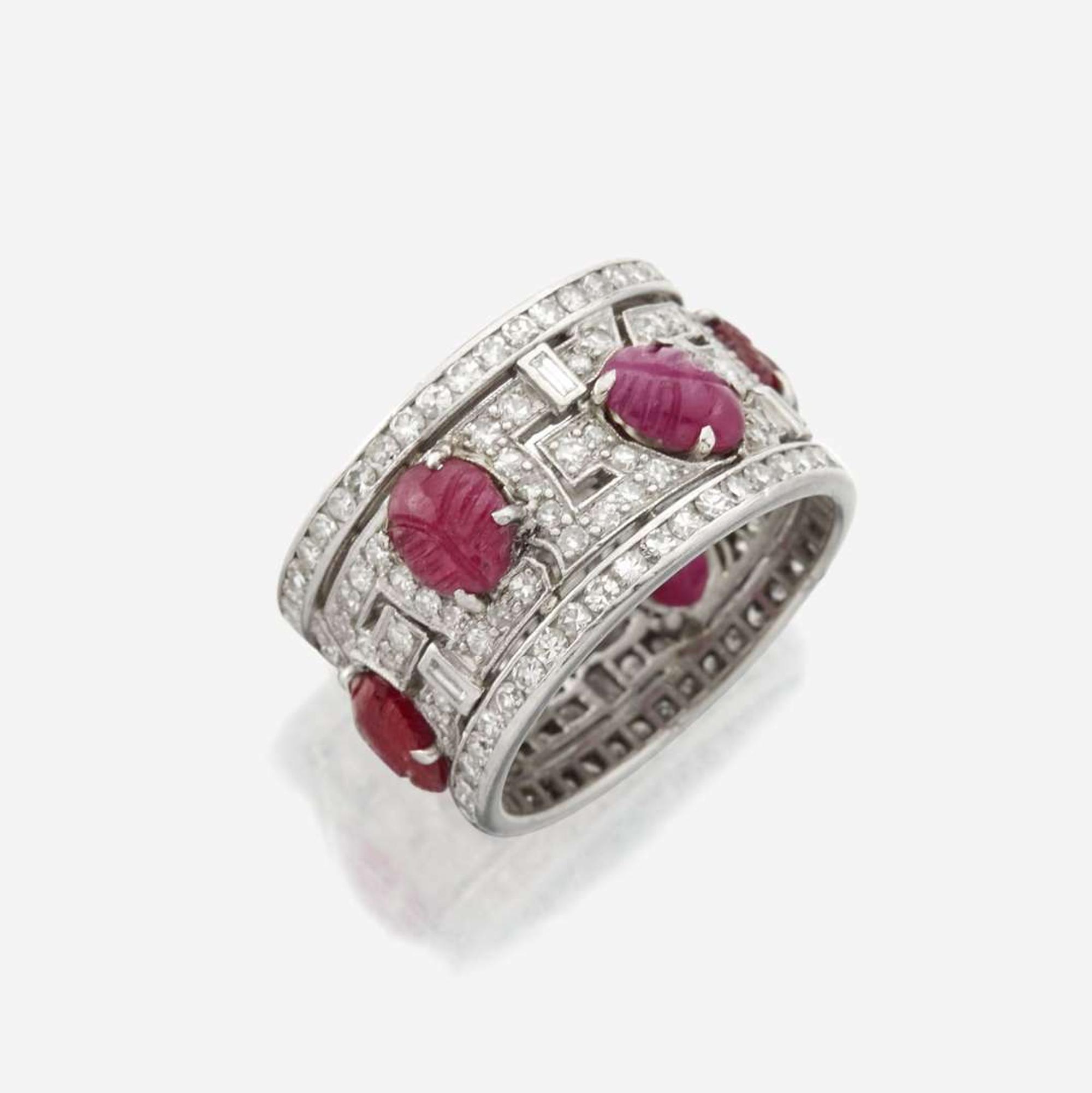 An Art Deco diamond, ruby, and platinum wide band