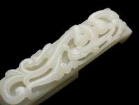 A Chinese Carved White Jade Joined Roundel and a White Jade "Dragon" Buckle, Qing Dynasty 清 白玉龍鈎及帶扣