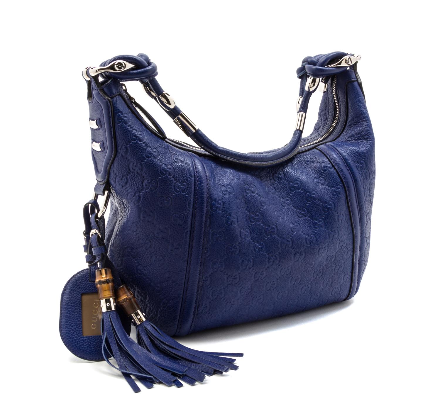 A Gucci Blue Monogram Leather Bag, 14 1/2 x 11 x 4 1/2 inches.
