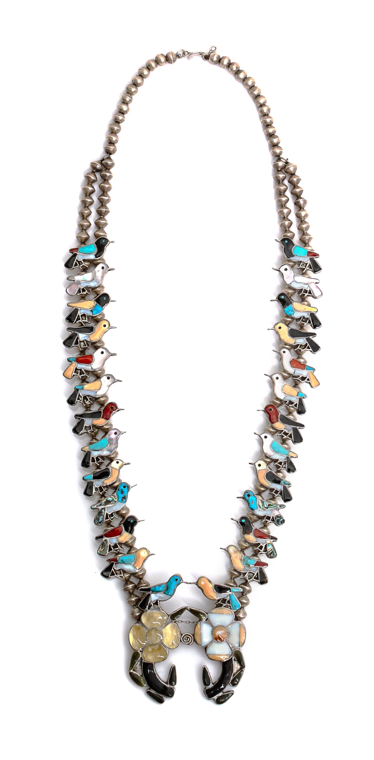A Zuni Channel Inlaid Hummingbird Necklace Length 26 inches.