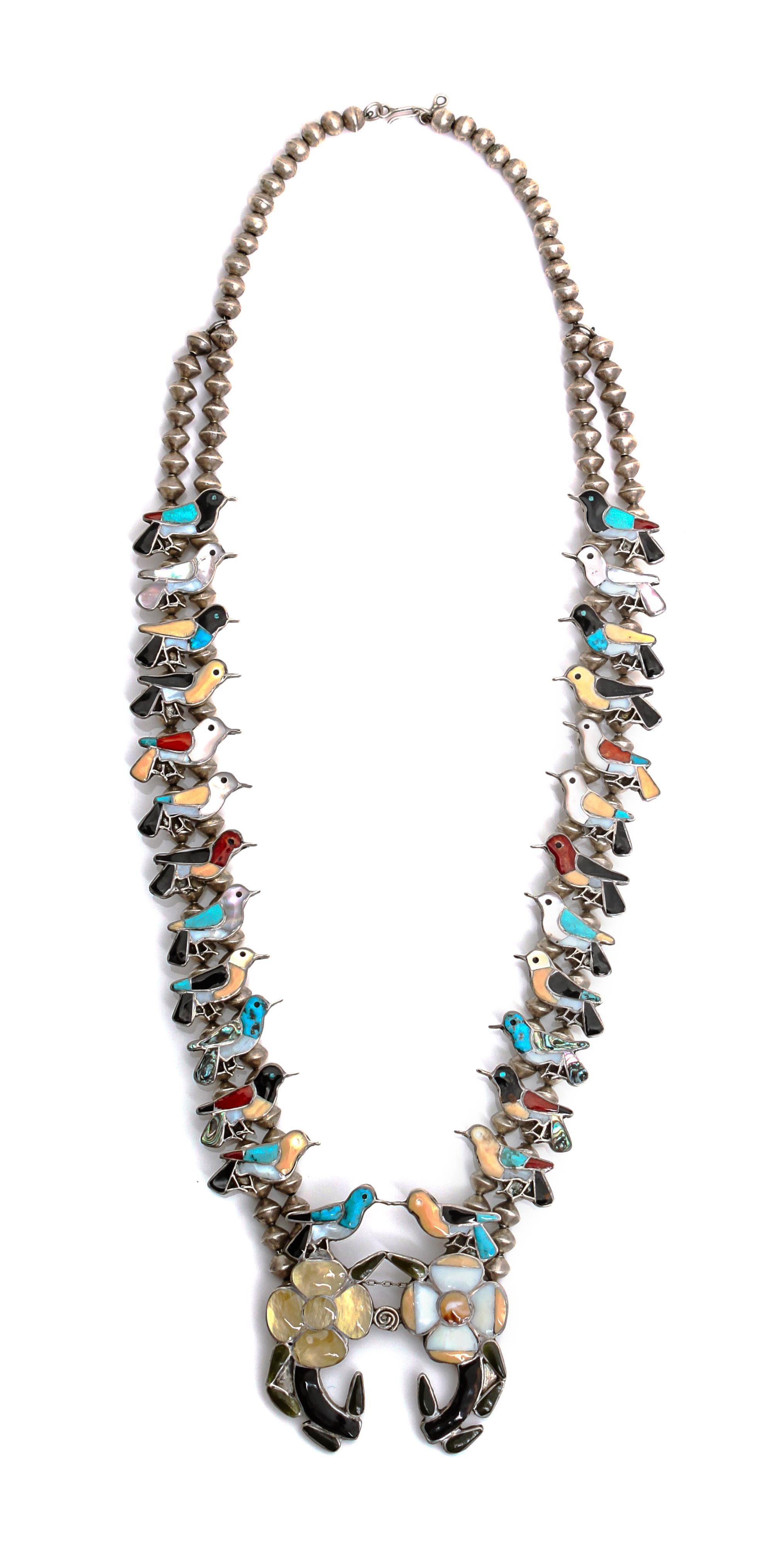 A Zuni Channel Inlaid Hummingbird Necklace Length 26 inches.