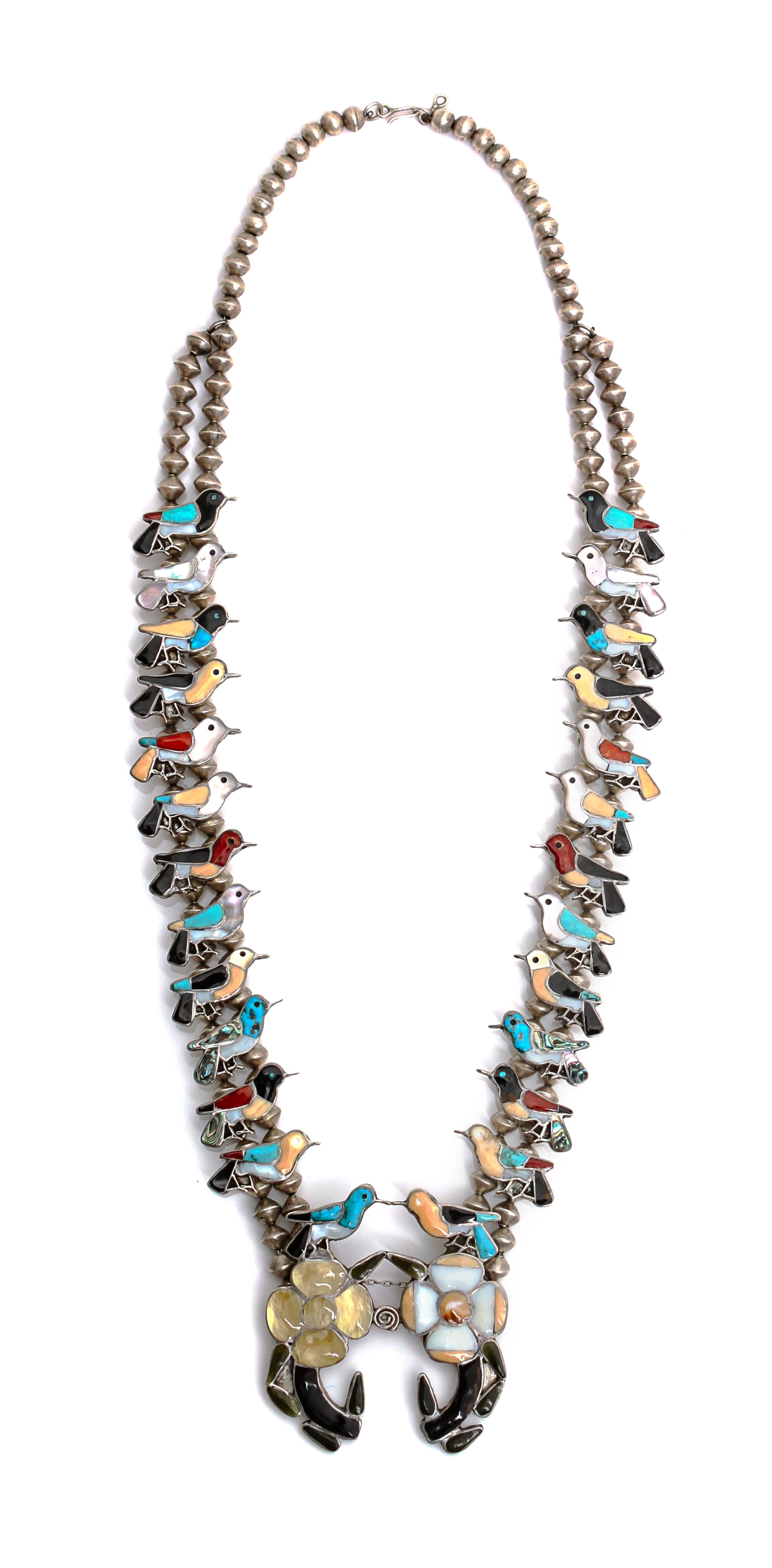 A Zuni Channel Inlaid Hummingbird Necklace Length 26 inches.