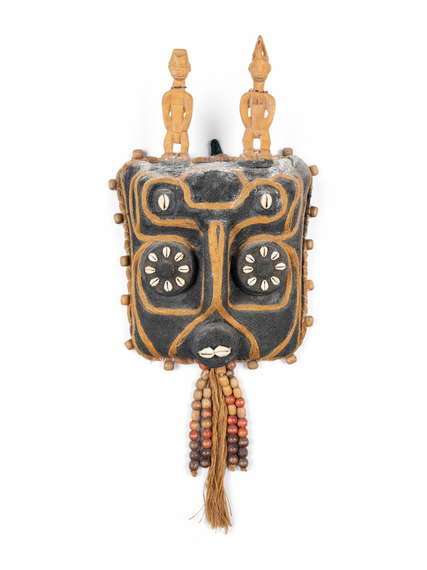 A Benin Shell and Woven Reed Mask with Carved Figures