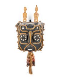 A Benin Shell and Woven Reed Mask with Carved Figures