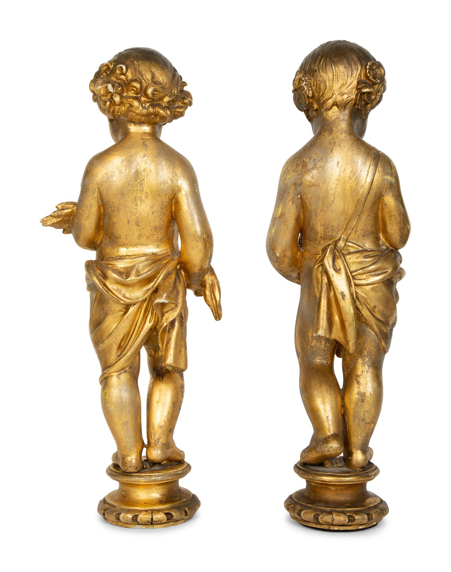 A Pair of Continental Giltwood Figures of Putti