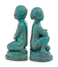 A Pair of Patinated Cast Metal Figures