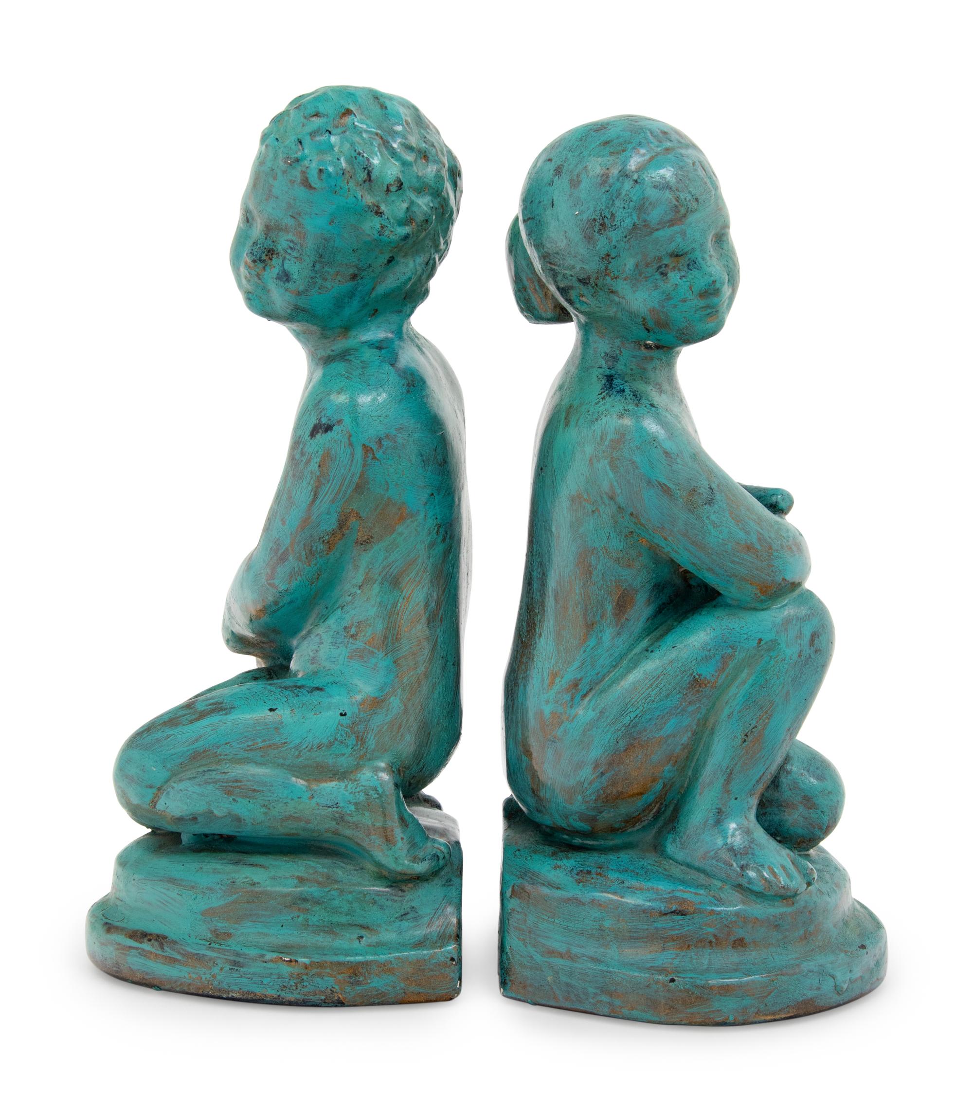 A Pair of Patinated Cast Metal Figures