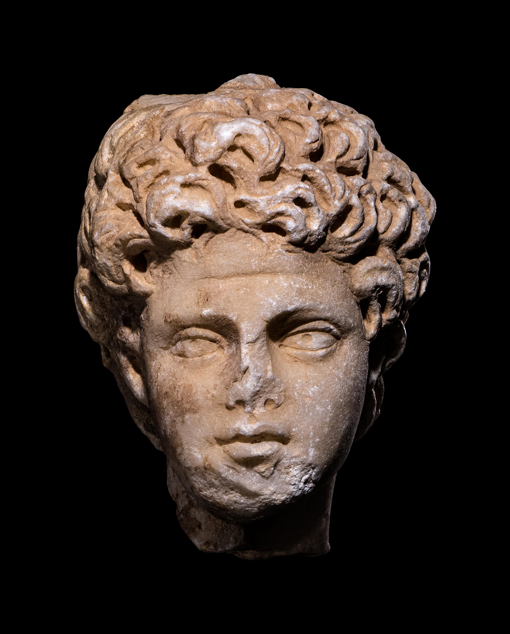 A Roman Marble Portrait Head of a Male Youth