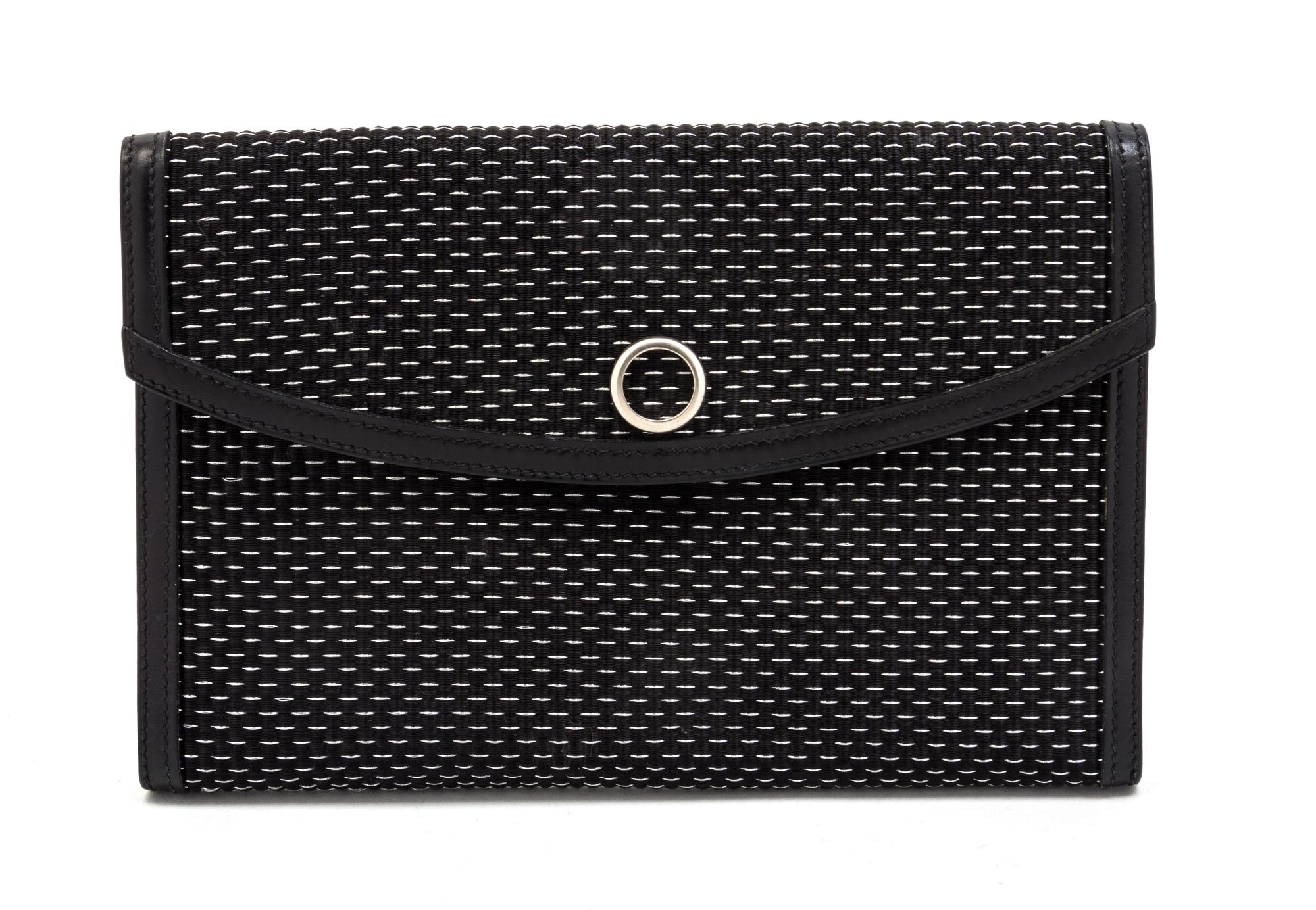 An Hermes Black and Silver Lame Woven Clutch, 9 1/2 x 6 x 1 inches.