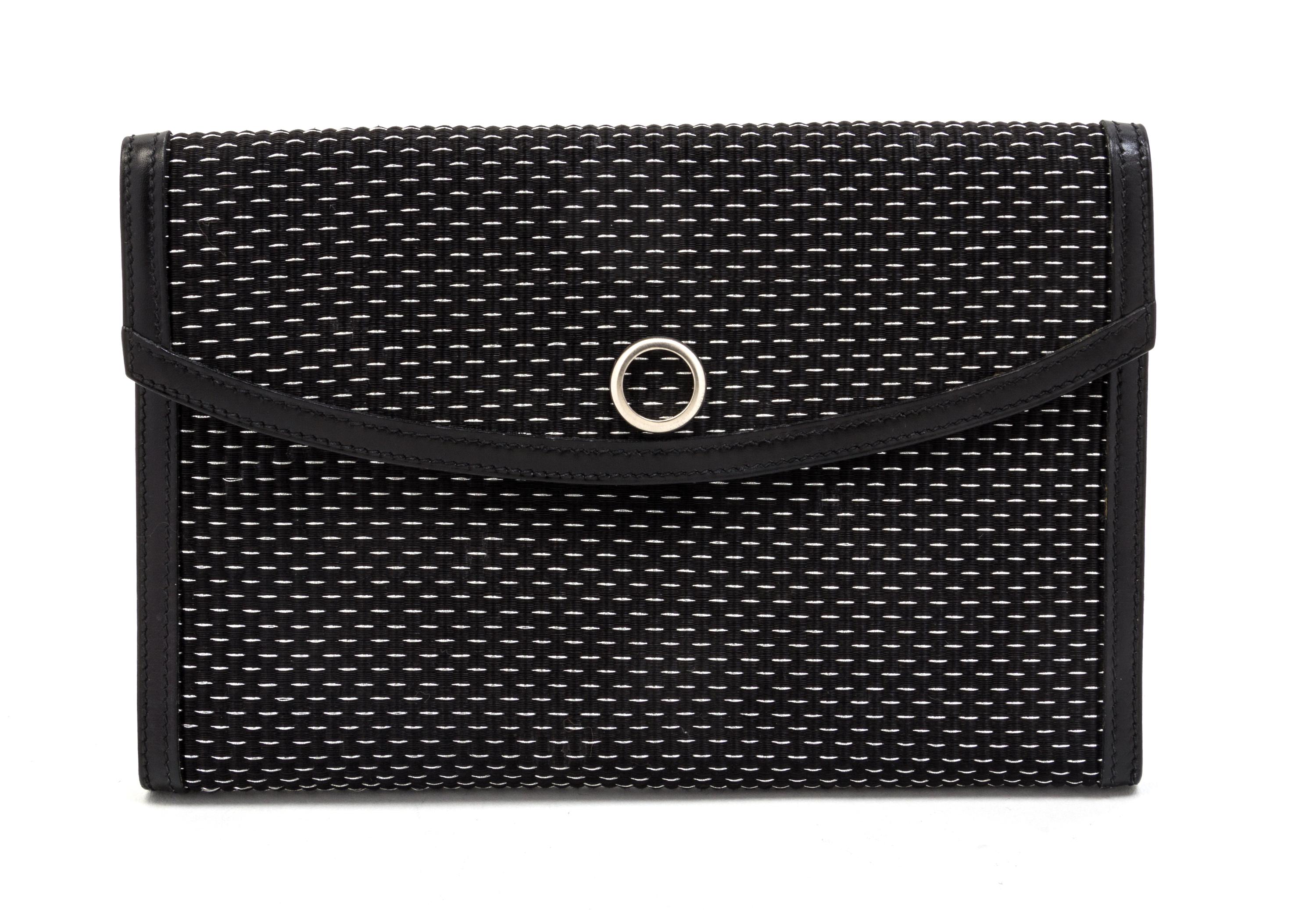 An Hermes Black and Silver Lame Woven Clutch, 9 1/2 x 6 x 1 inches.