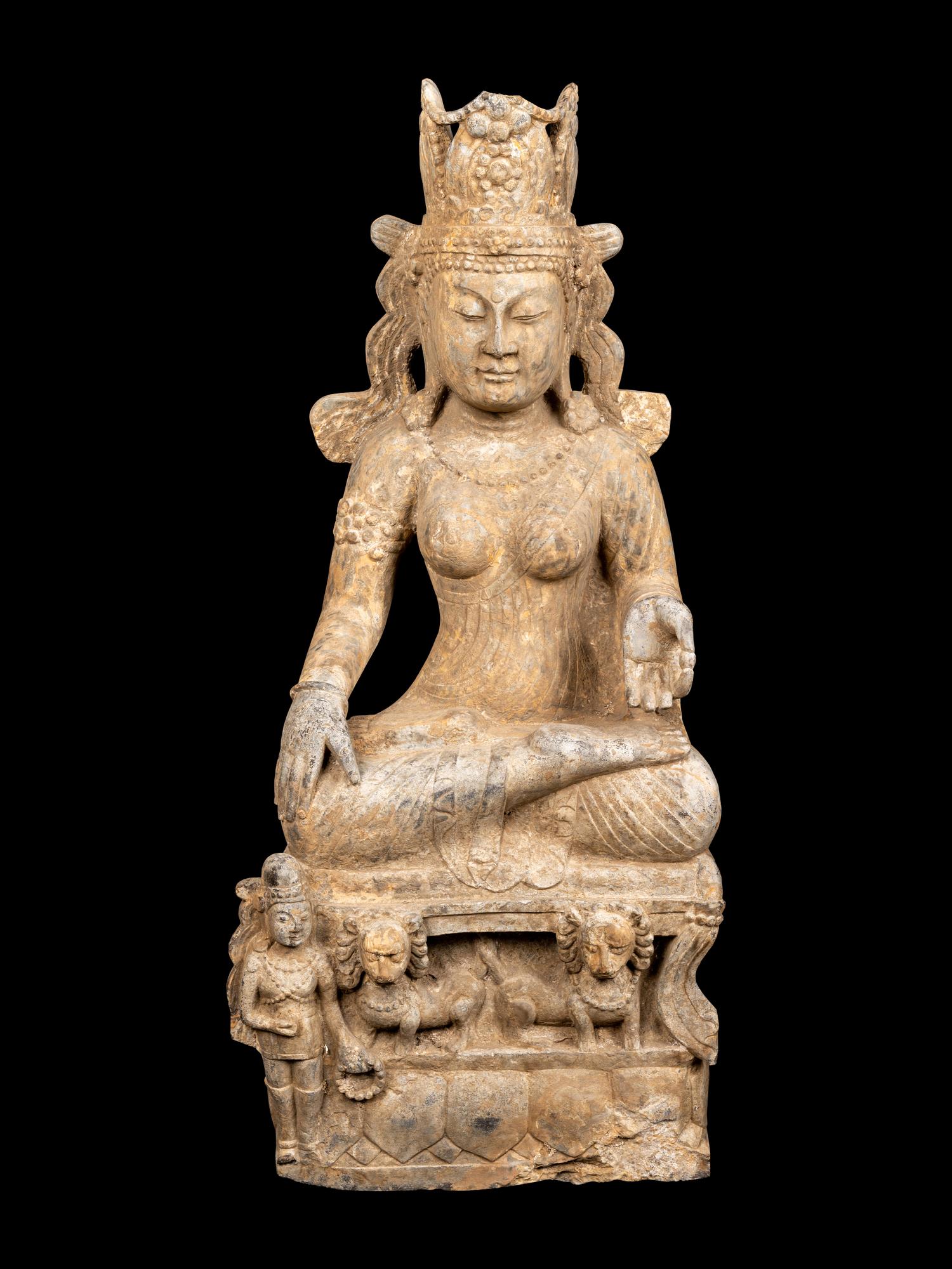 A Chinese Carved Stone Seated Guanyin Figure