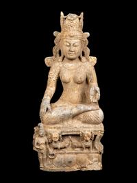 A Chinese Carved Stone Seated Guanyin Figure