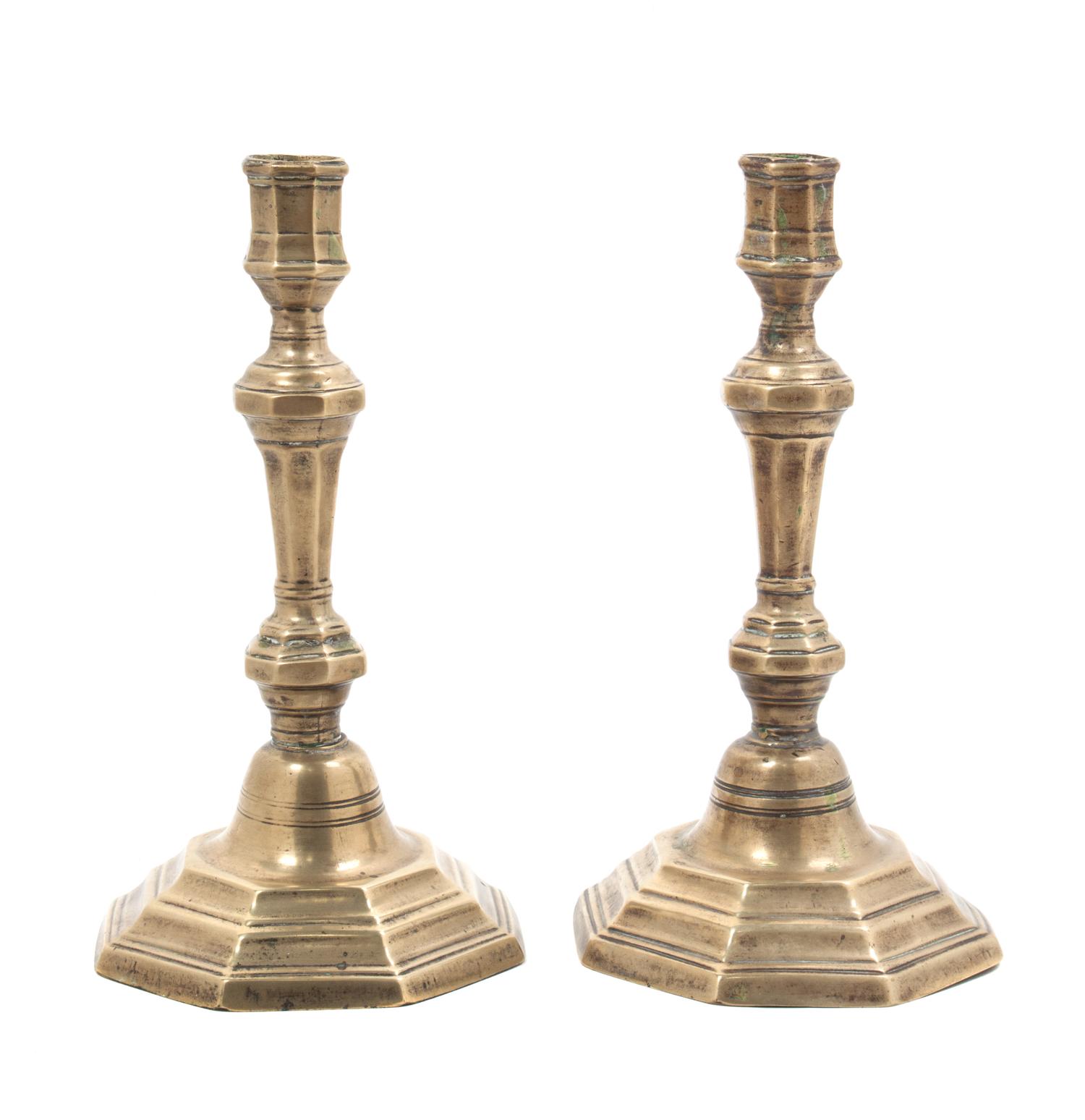 A Pair of George III Brass Candlesticks Height 9 inches.