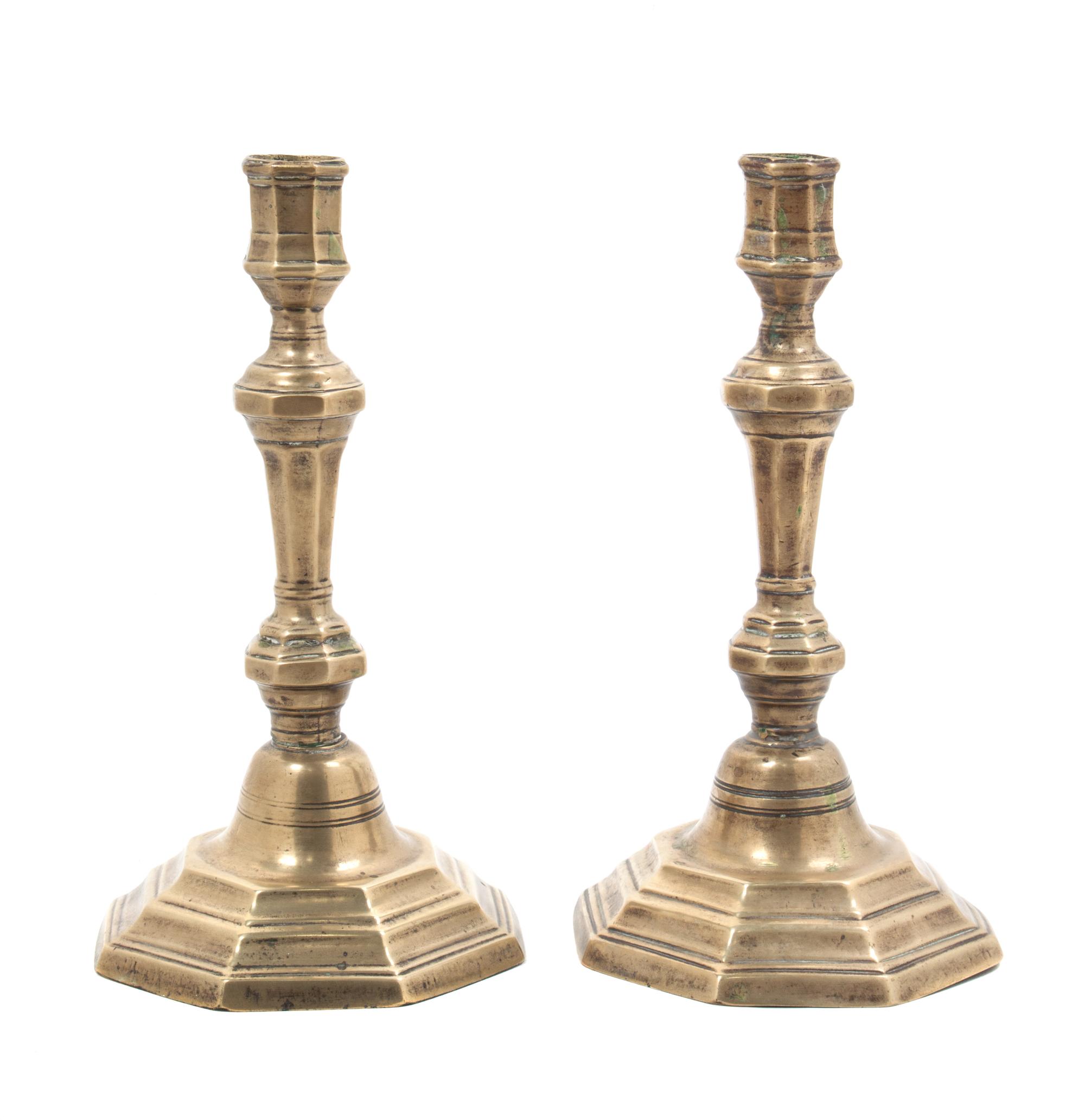 A Pair of George III Brass Candlesticks Height 9 inches.