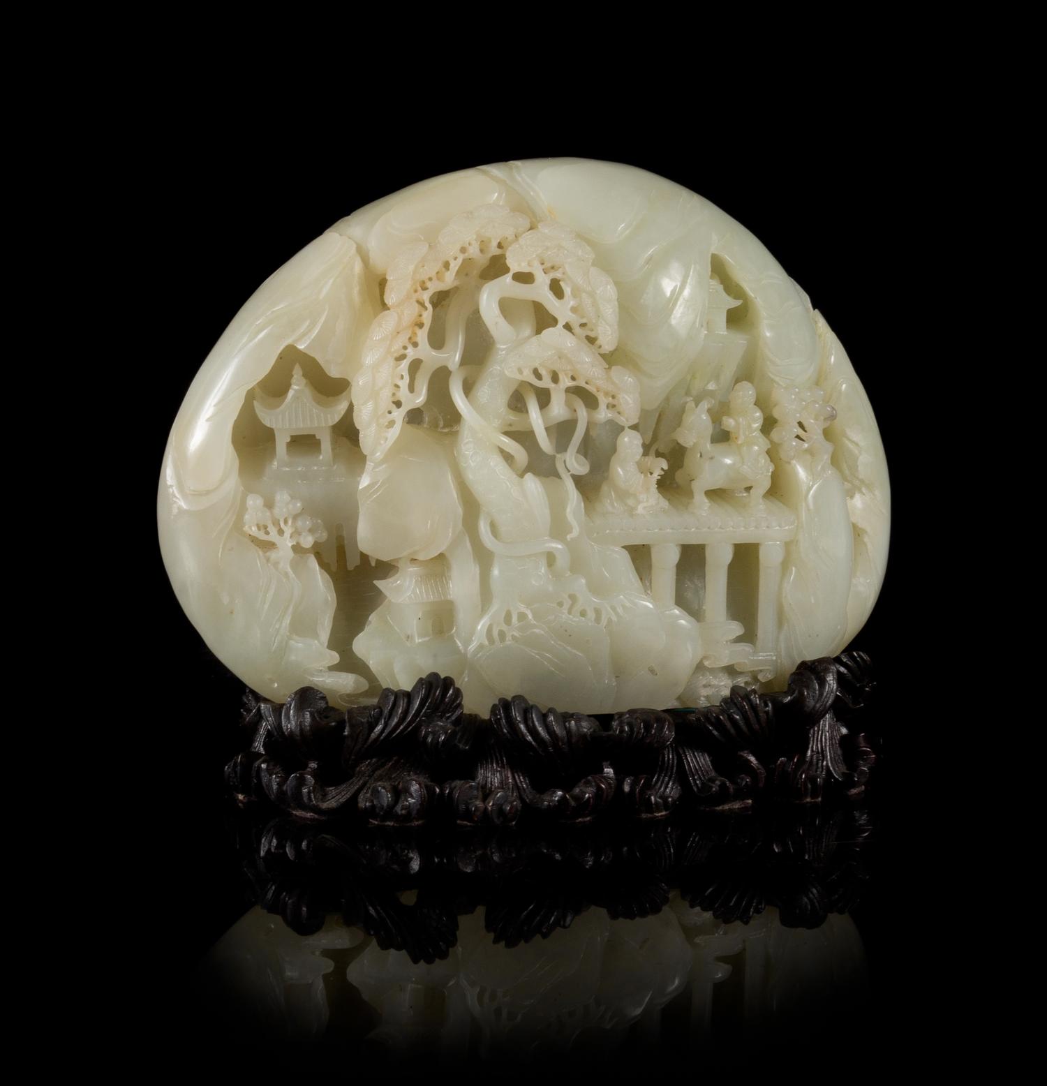 A Carved Pale Celadon Jade Boulder Height 7 x width 8 inches.