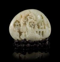 A Carved Pale Celadon Jade Boulder Height 7 x width 8 inches.