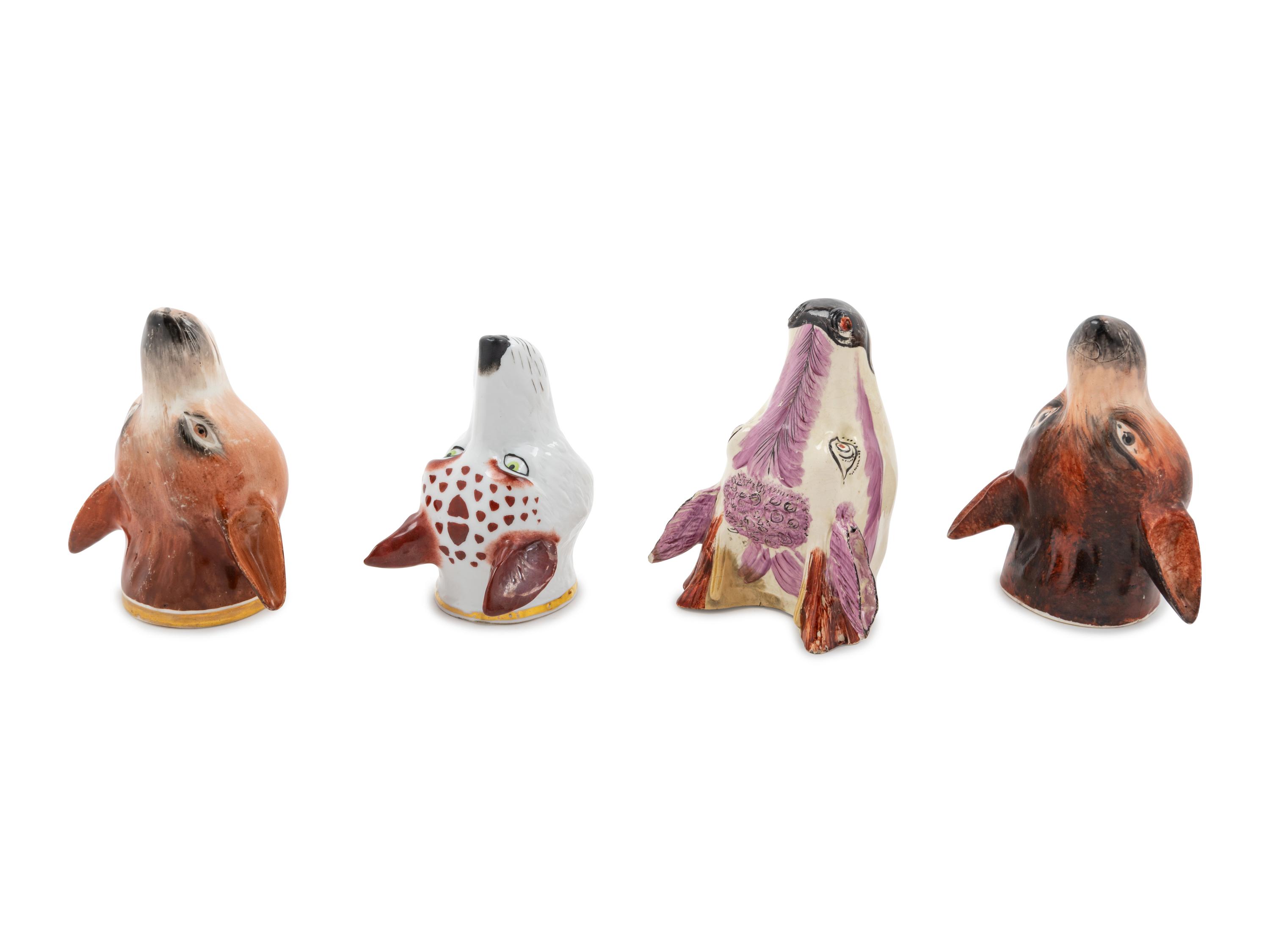 Four Staffordshire Pottery Stirrup Cups