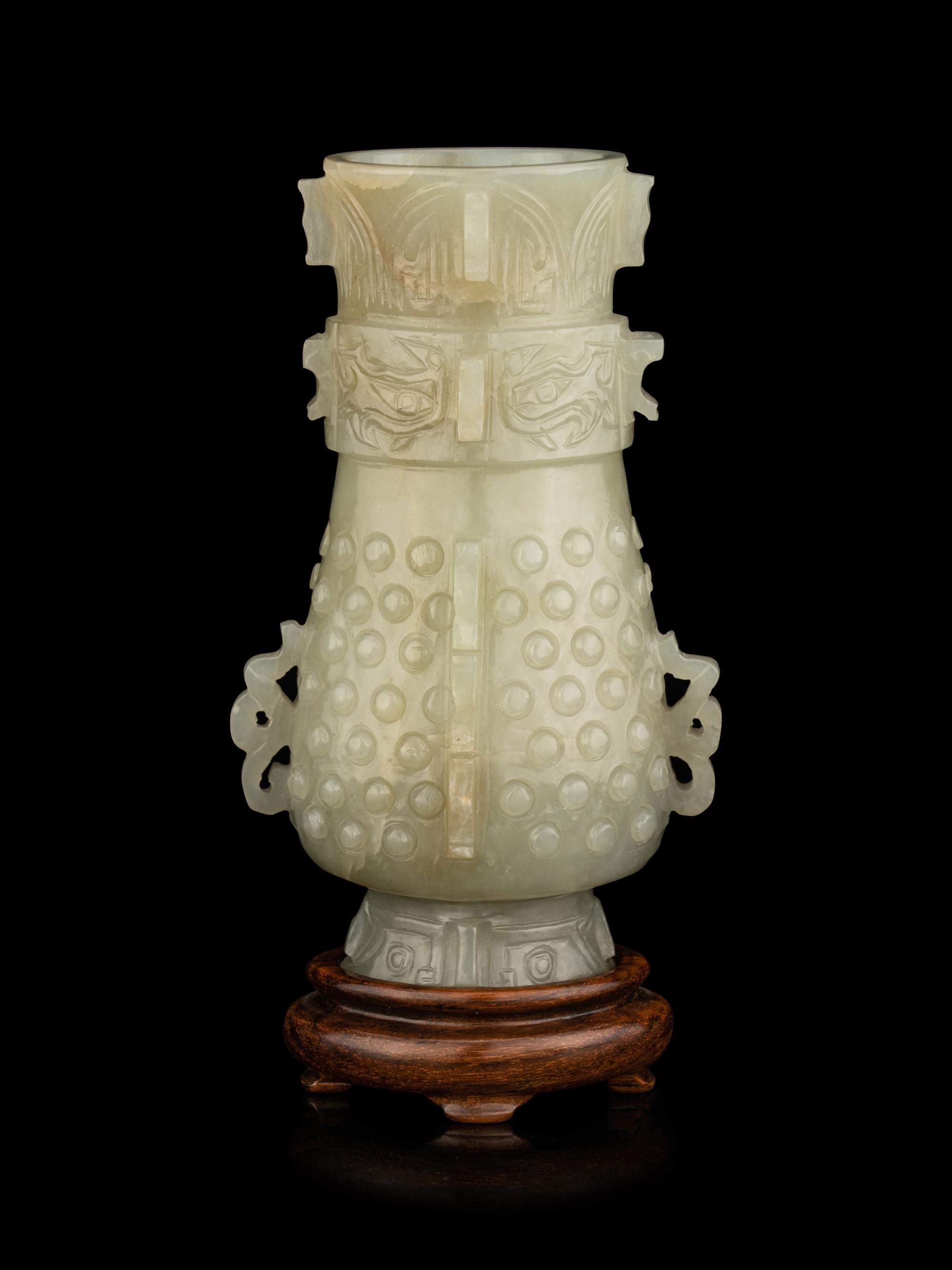 A Carved Pale Celadon Jade Hu Vase