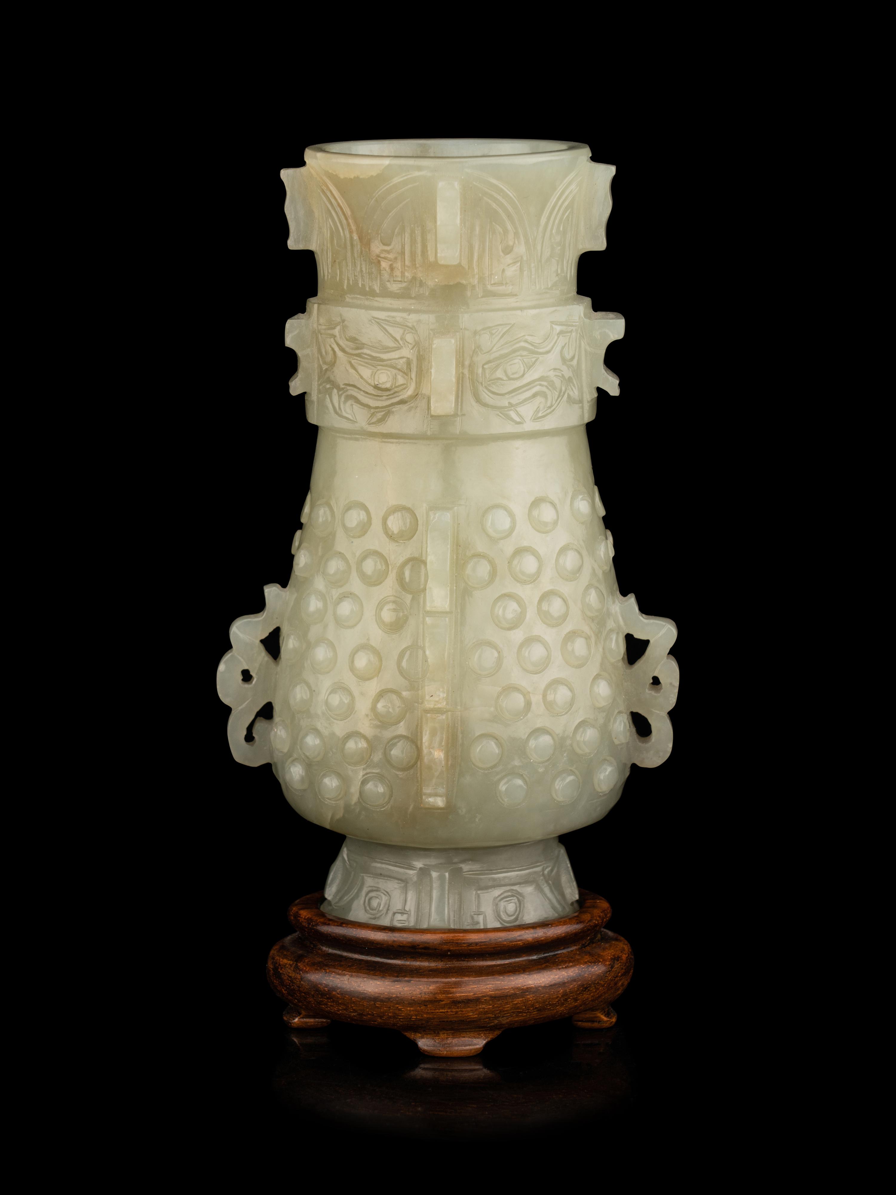 A Carved Pale Celadon Jade Hu Vase