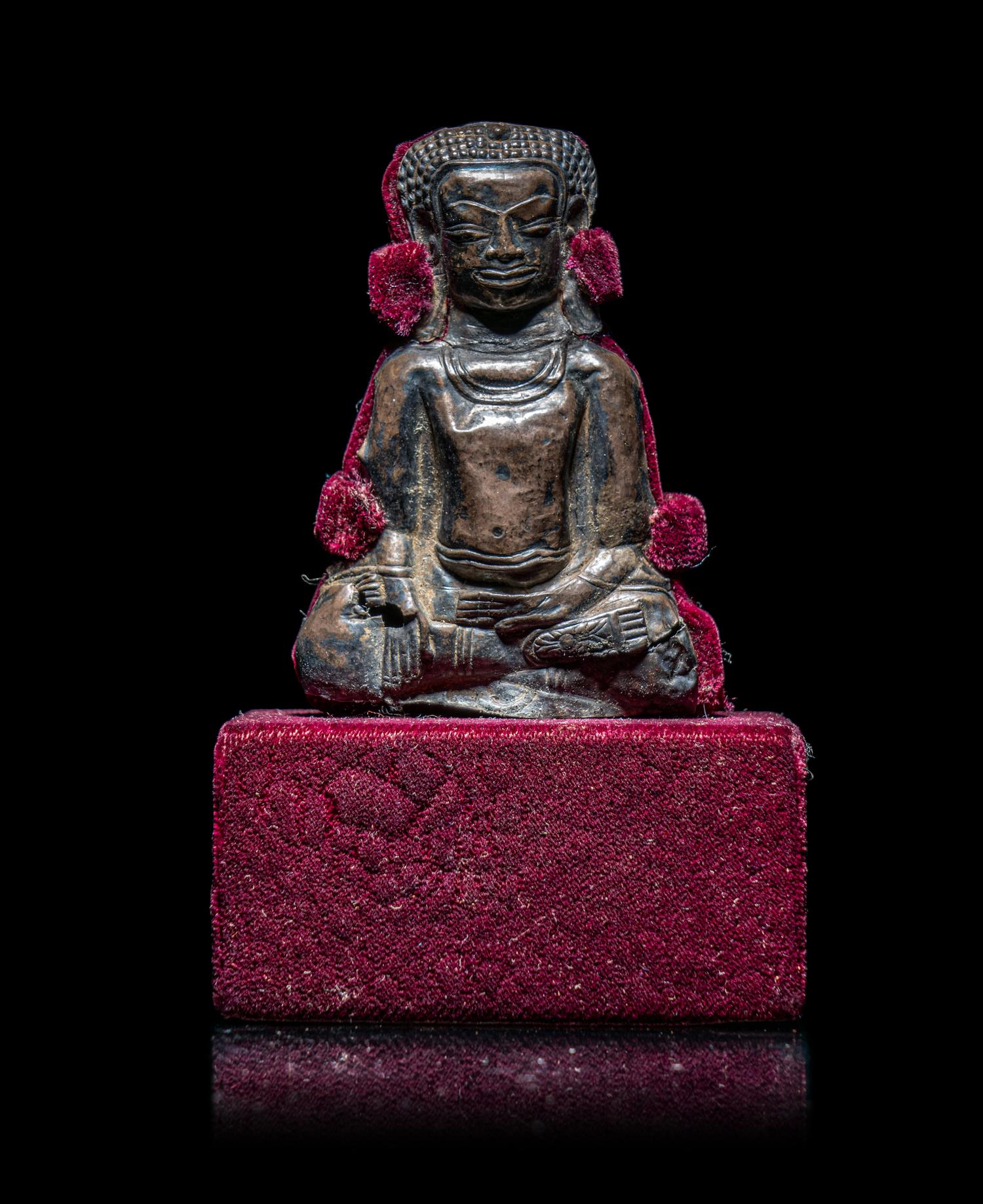 A Thai Silvered Metal Repoussé Plaque of Buddha