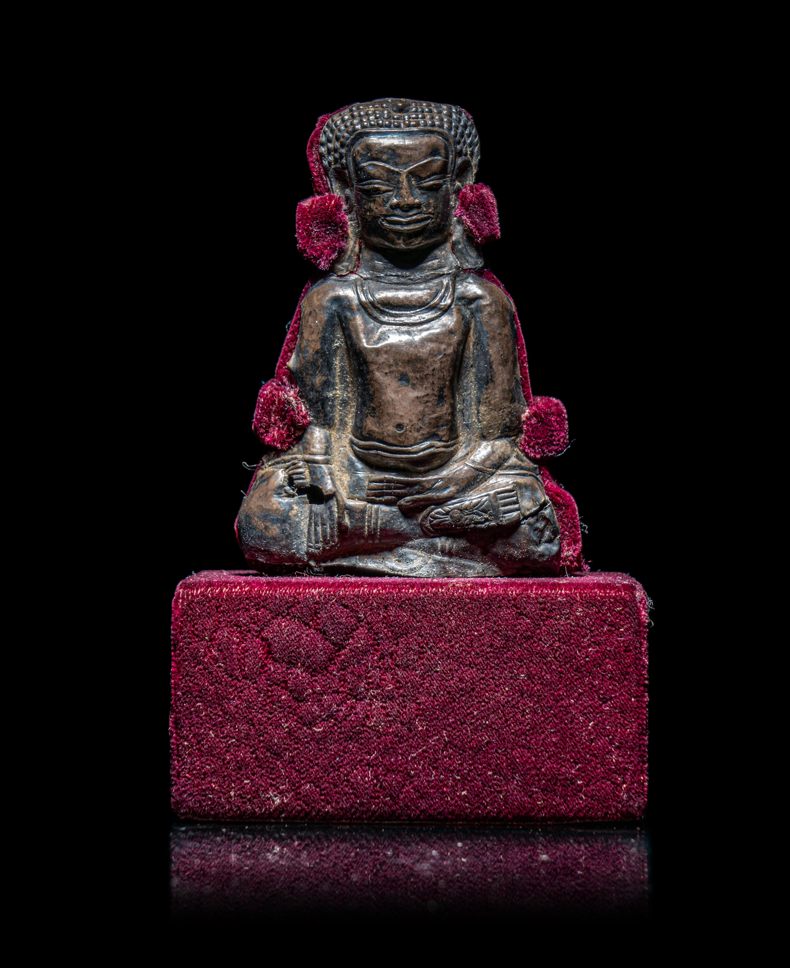 A Thai Silvered Metal Repoussé Plaque of Buddha