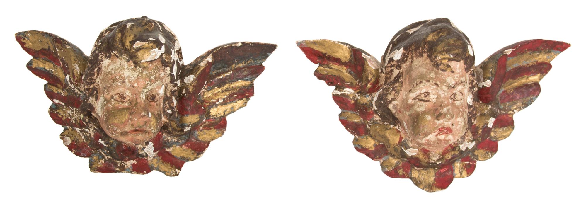 A Pair of Italian Painted and Parcel Gilt Putto Masks Height 6 x width 10 x depth 5 inches. — 18TH CENTURY